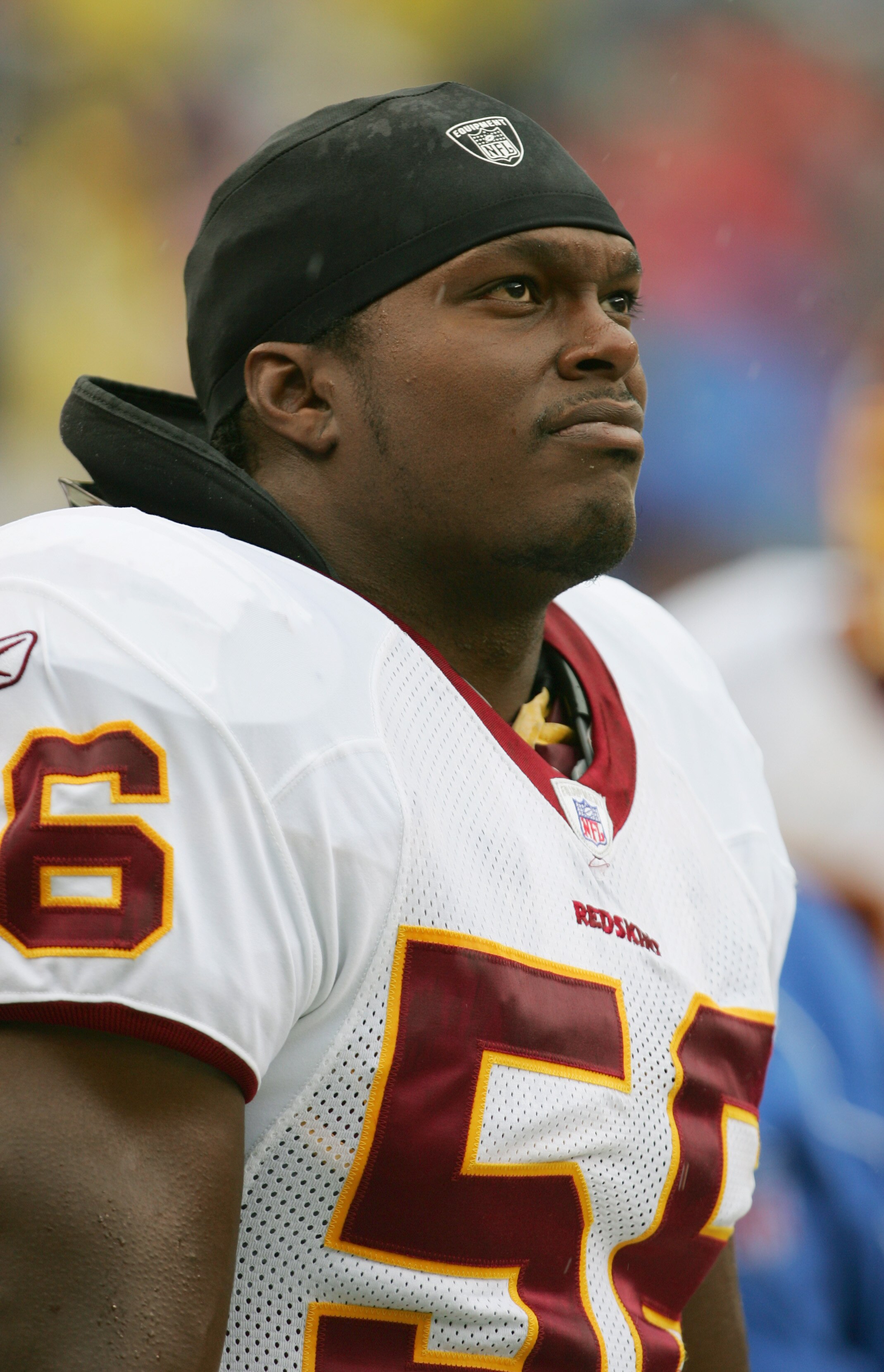 DENVER, CO - OCTOBER  9: LaVar Arrington #56 of the Washington Redskins looks on from the sidelines during the game against the Denver Broncos during game at Invesco Field at Mile High on October 9, 2005 in Denver, Colorado. The Broncos won 21-19. (Photo