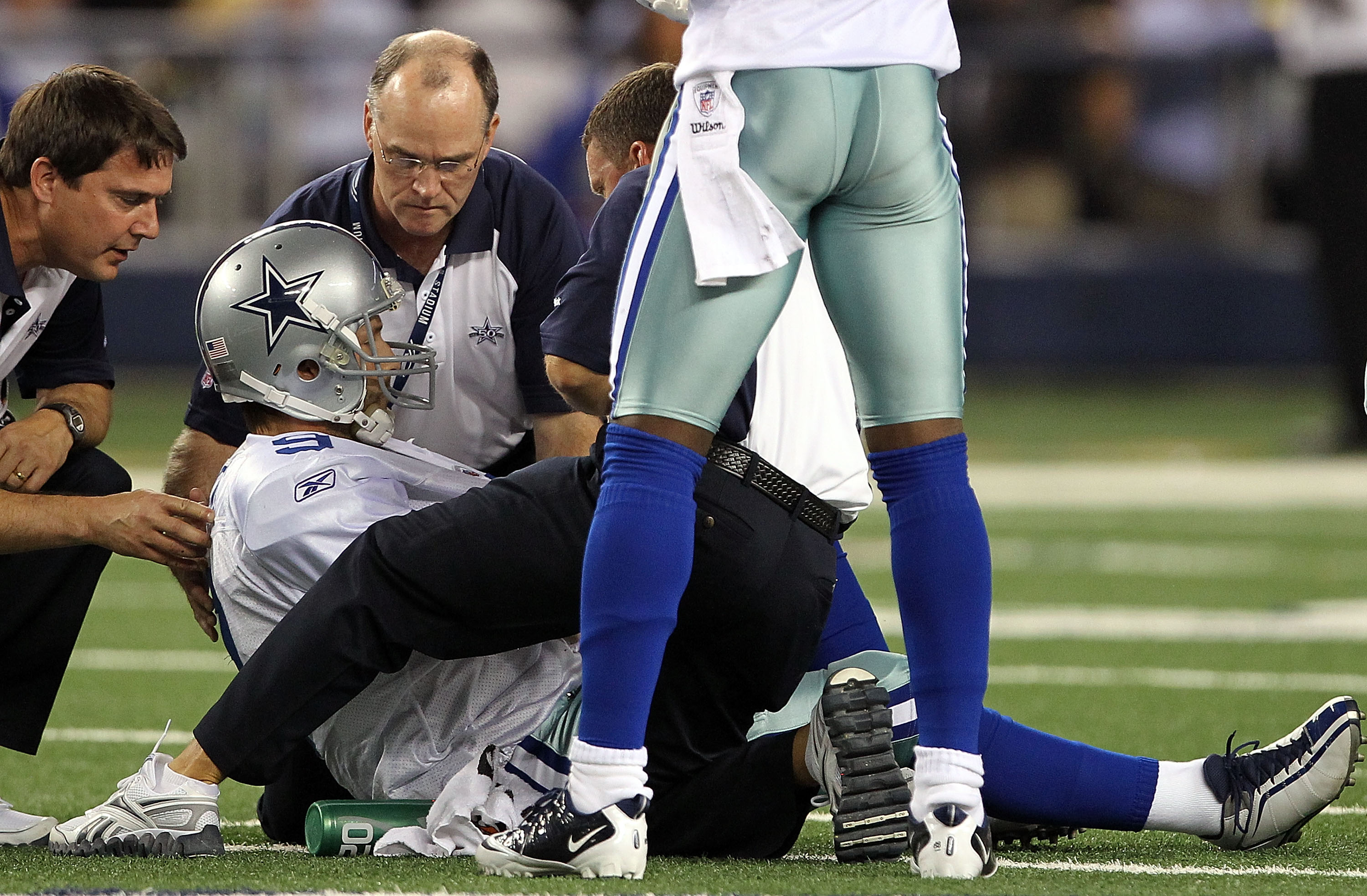 ARLINGTON, TX - OCTOBER 25:  Quarterback Tony Romo #9 of the Dallas Cowboys lies on the field after a left shoulder injury in the second quarter against the New York Giants at Cowboys Stadium on October 25, 2010 in Arlington, Texas.  (Photo by Ronald Mart