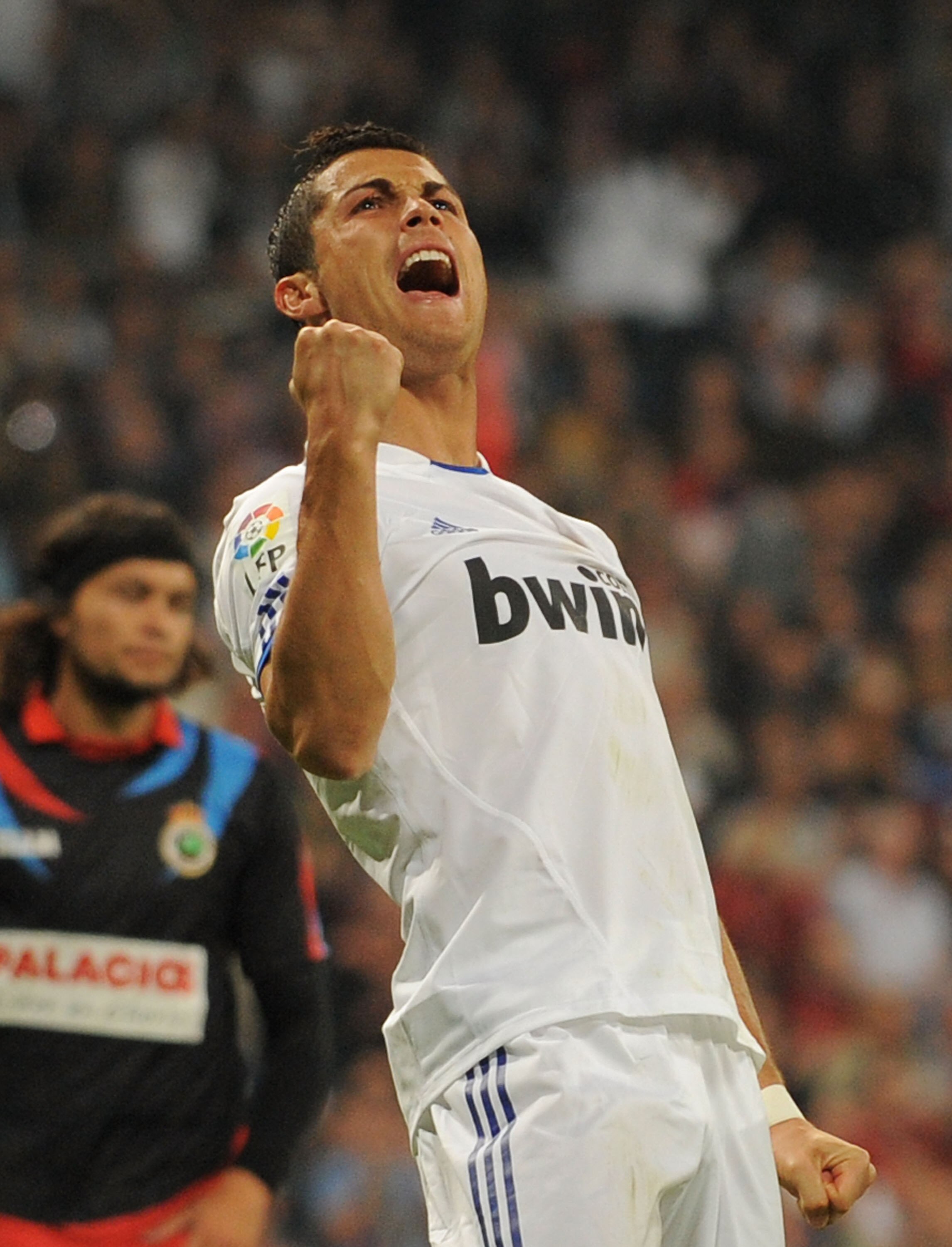 MADRID, SPAIN - OCTOBER 23:  Cristiano Ronaldo of Real Madrid celebrates after scoring Real's 5th goal during the La Liga match between Real Madrid and Racing Santander at Estadio Santiago Bernabeu on October 23, 2010 in Madrid, Spain.  (Photo by Denis Do