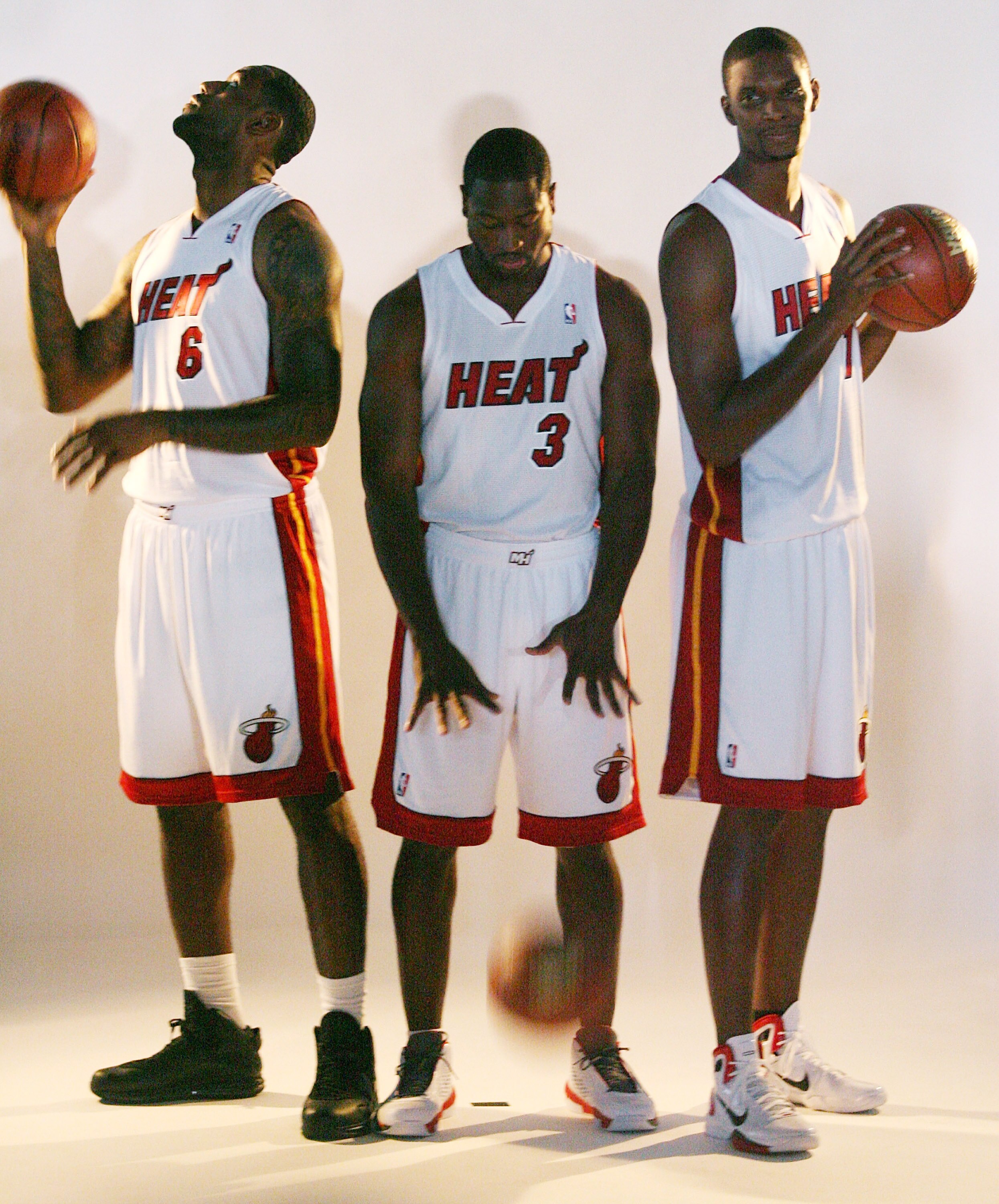 MIAMI - SEPTEMBER 27:  (L-R) LeBron James, Dwyane Wade and Chris Bosh of the Miami Heat pose for photos during media day at the Bank United Center on September 27, 2010 in Miami, Florida.  (Photo by Marc Serota/Getty Images)