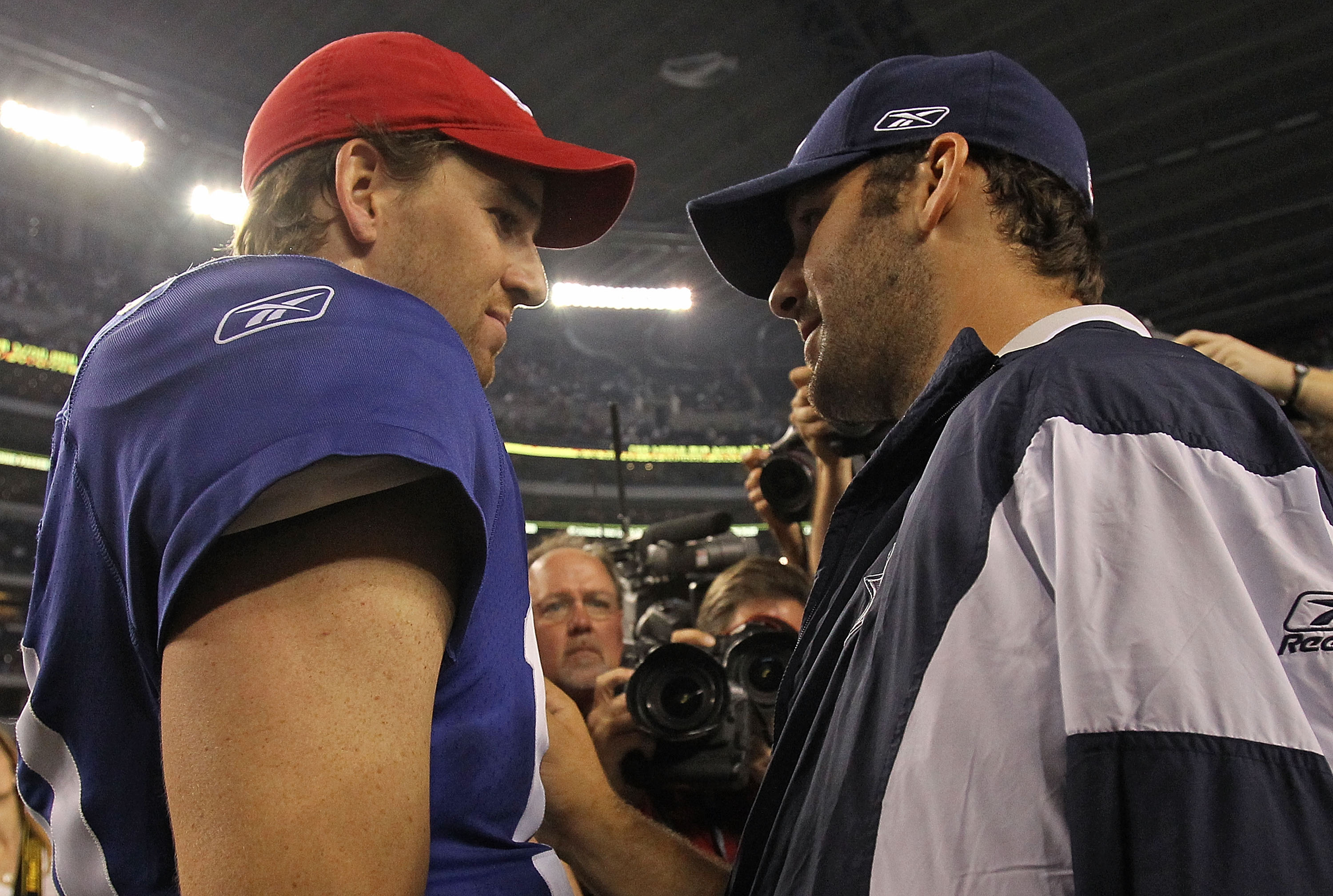 ARLINGTON, TX - OCTOBER 25:  Quarterback Tony Romo #9 of the Dallas Cowboys talks with Eli Manning #10 of the New York Giants after a game at Cowboys Stadium on October 25, 2010 in Arlington, Texas.  (Photo by Ronald Martinez/Getty Images)