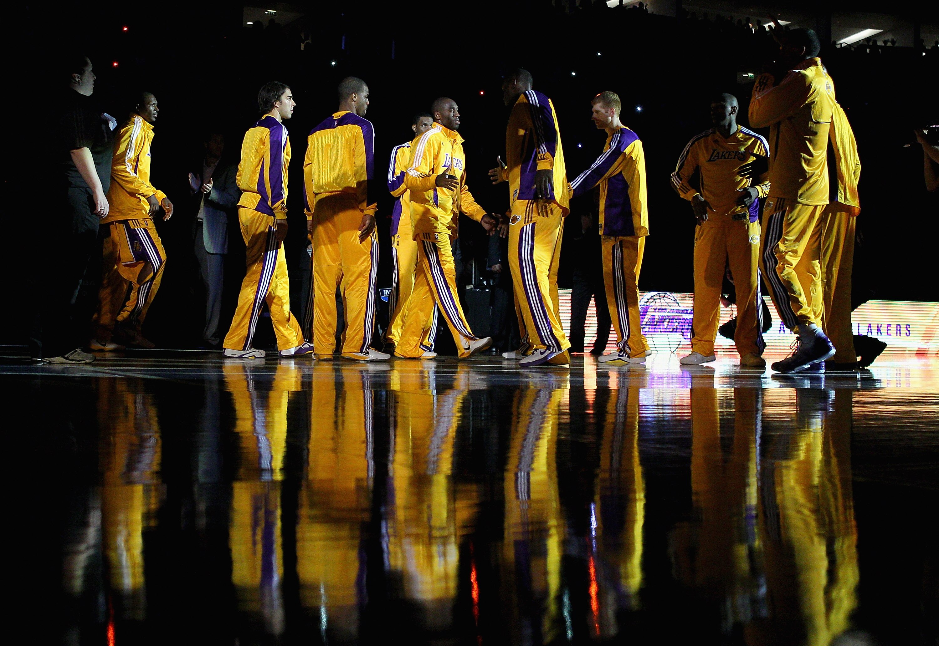 LONDON, ENGLAND - OCTOBER 04:  Kobe Bryant of the Los Angeles Lakers (C) is welcomed onto the court by teammates ahead of the NBA Europe Live match between the Los Angeles Lakers and the Minnesota Timberwolves at the O2 arena on October 4, 2010 in London,