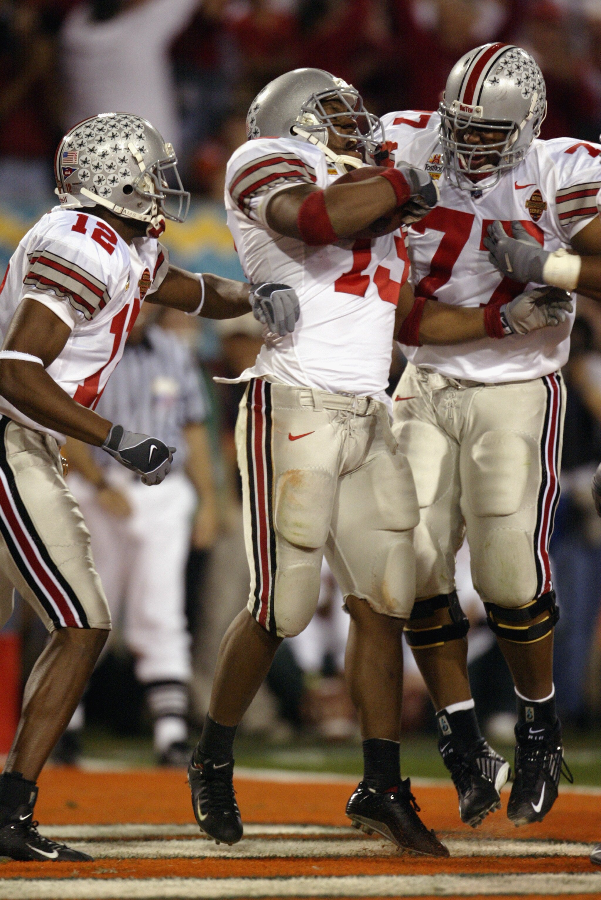 TEMPE, AZ - JANUARY 3:  Running back Maurice Clarett #13 of the Ohio State Buckeyes celebrates after scoring the team's second touchdown against the University of Miami Hurricanes during the Tostitos Fiesta Bowl at Sun Devil Stadium on January 3, 2003 in 