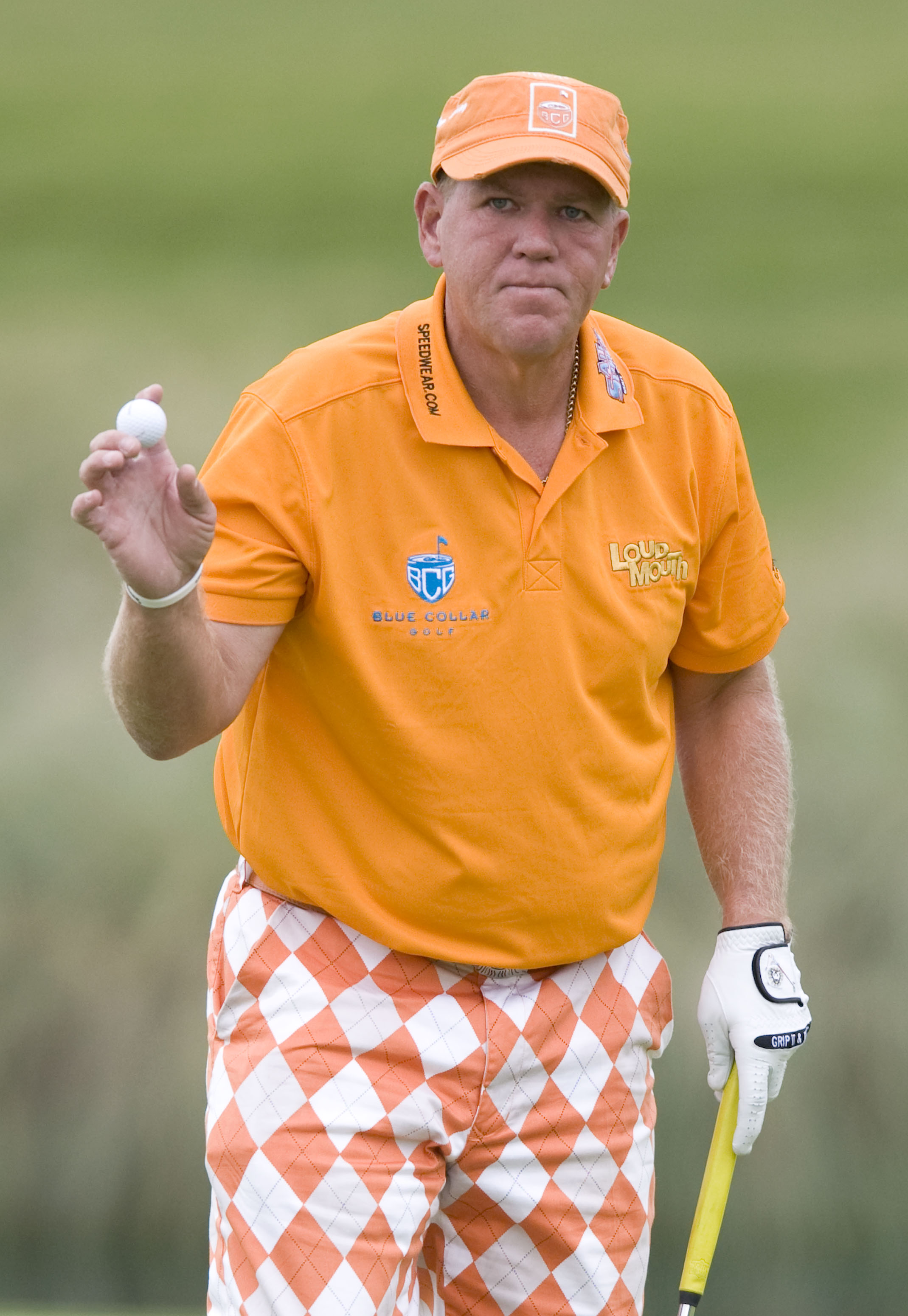 LAS VEGAS, NV - OCTOBER 21: John Daly acknowledges the crowd after sinking his putt on the 18th hole during the first round of the Justin Timberlake Shriners Hospitals for Children Open on October 21, 2010 in Las Vegas, Nevada. (Photo by Steve Dykes/Getty