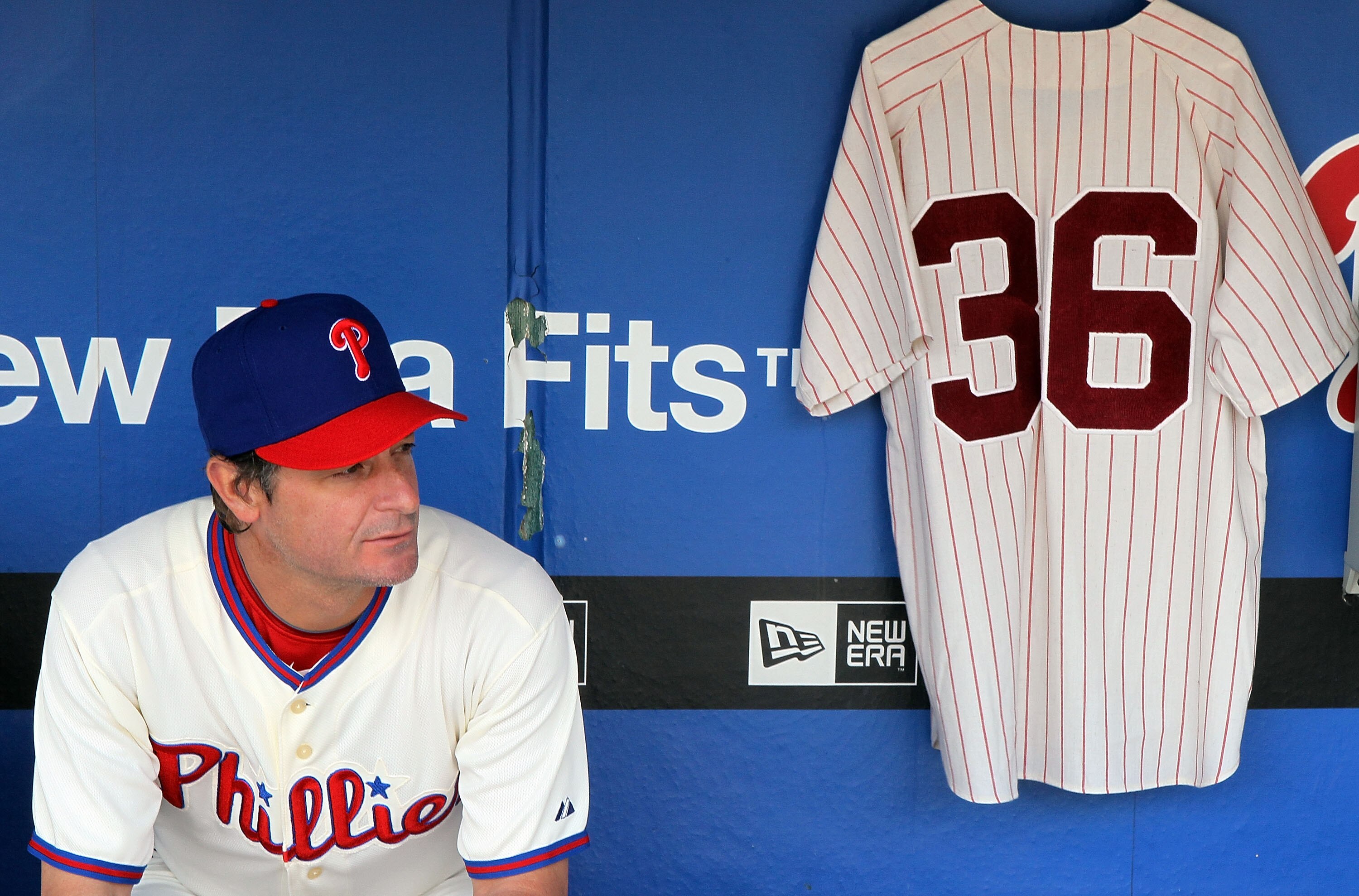 PHILADELPHIA - MAY 06:  Jamie Moyer #50 of the Philadelphia Phillies sits in the dugout next to a jersey of Phillies Hall of Fame pitcher Robin Roberts prior to playing the St. Louis Cardinals at Citizens Bank Park on May 6, 2010 in Philadelphia, Pennsylv