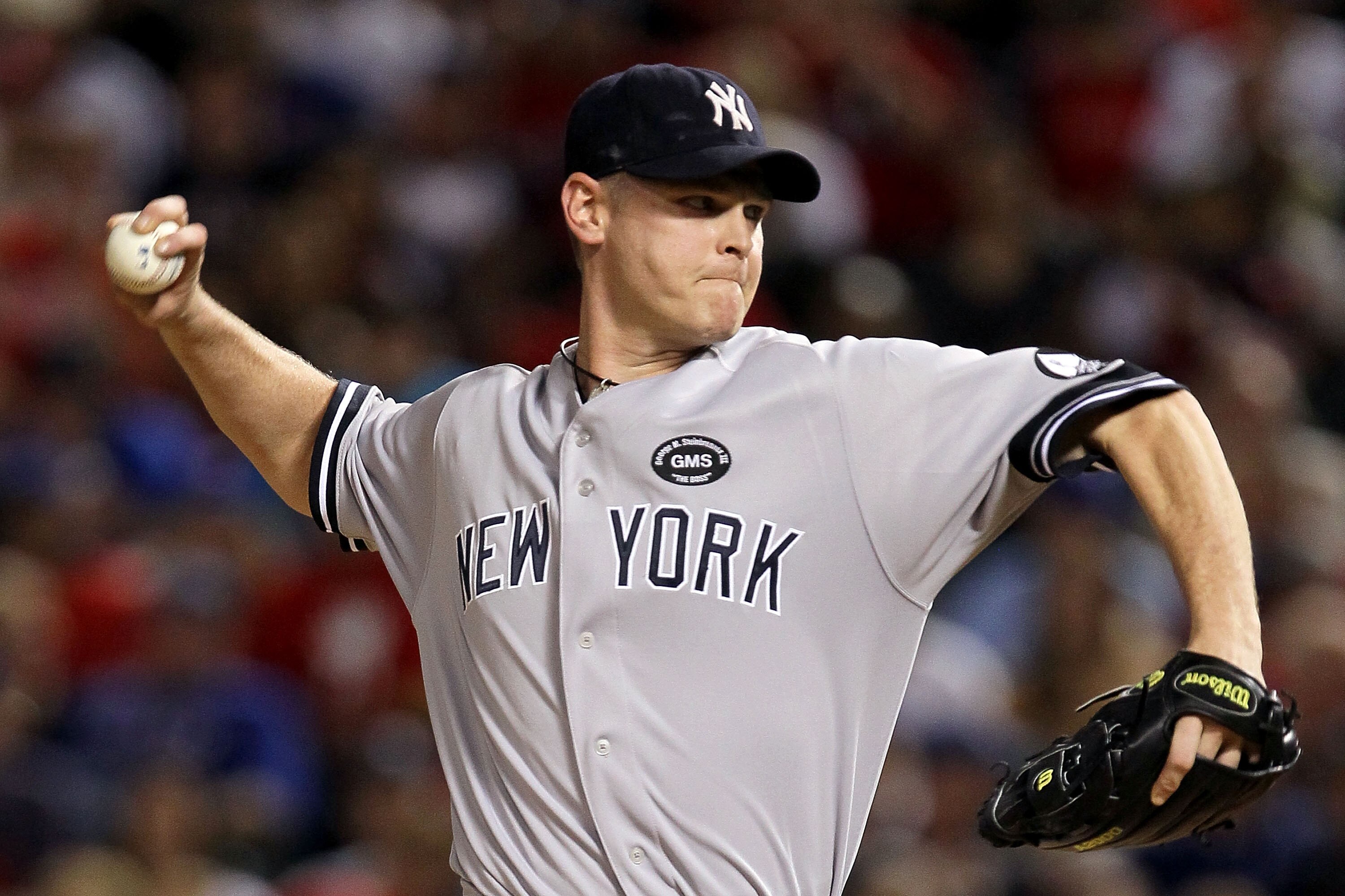 ARLINGTON, TX - OCTOBER 22:  Kerry Wood #39 of the New York Yankees throws a pitch against the Texas Rangers in Game Six of the ALCS during the 2010 MLB Playoffs at Rangers Ballpark in Arlington on October 22, 2010 in Arlington, Texas.  (Photo by Stephen