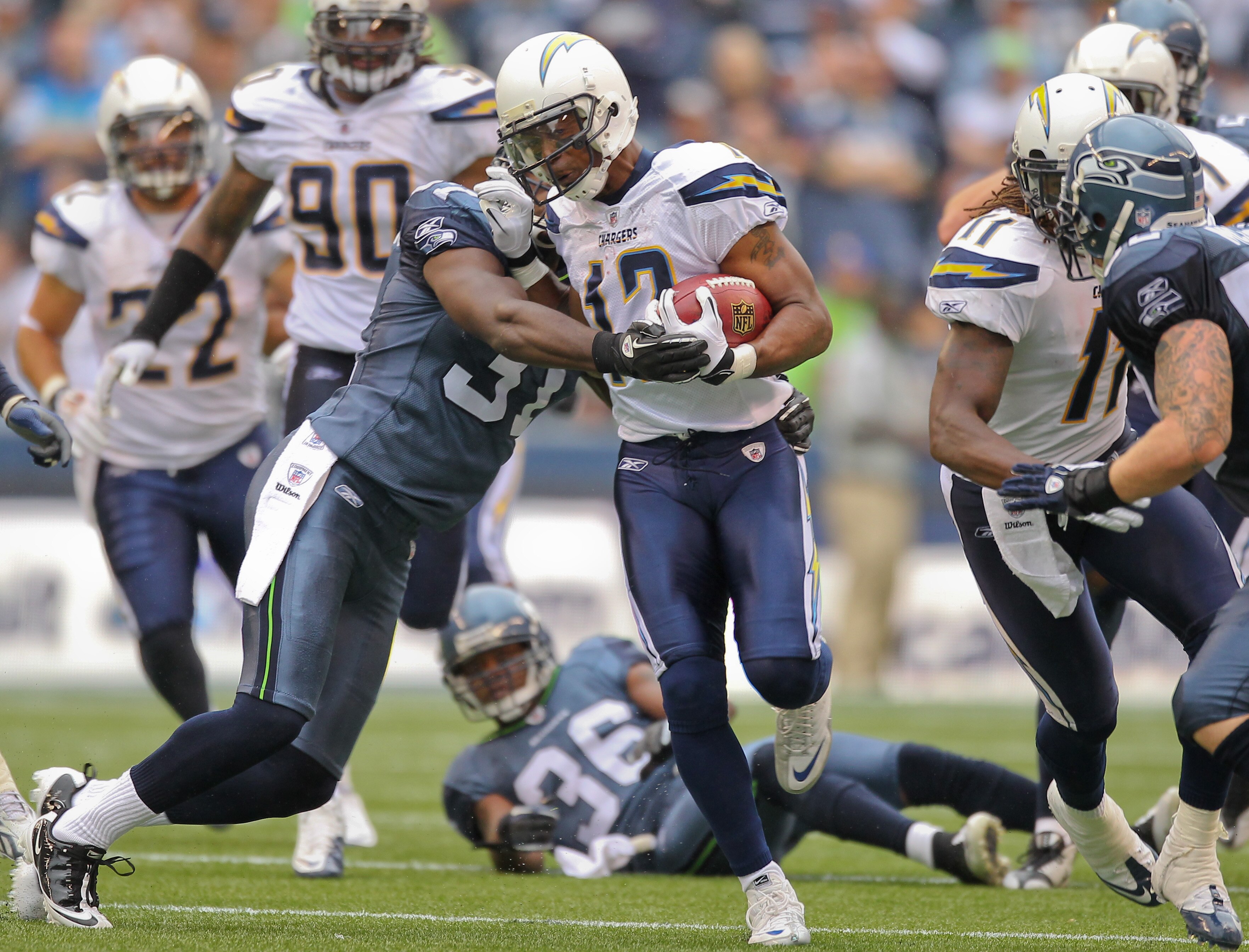 SEATTLE - SEPTEMBER 26:  Wide receiver Patrick Crayton #12 of the San Diego Chargers rushes against Kam Chancellor #31 of the Seattle Seahawks at Qwest Field on September 26, 2010 in Seattle, Washington. (Photo by Otto Greule Jr/Getty Images)