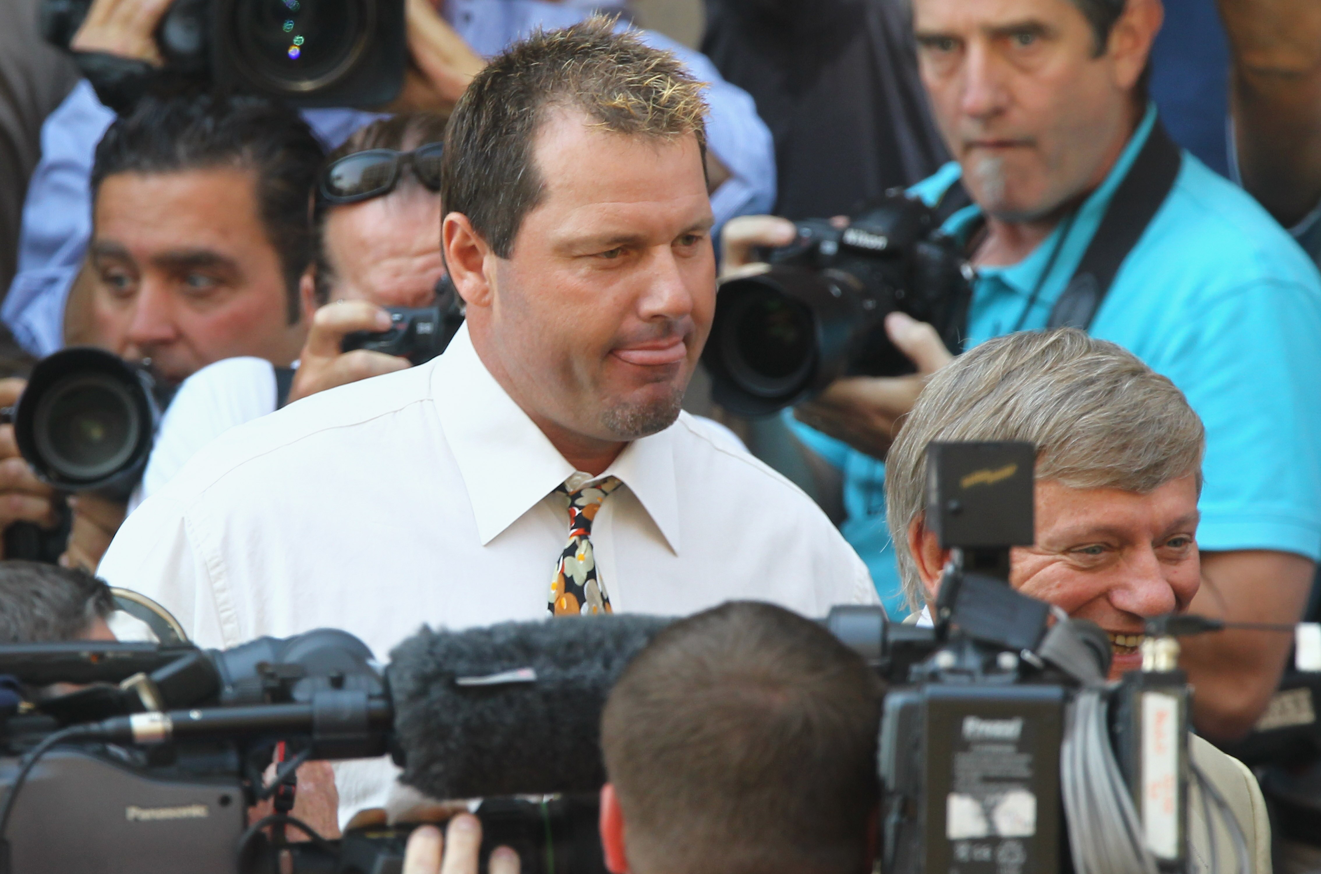 WASHINGTON - AUGUST 30:  Baseball pitching star Roger Clemens walks out of the U.S. District Court after his arraignment, on August 30, 2010 in Washington, DC. Seven-time Cy Young Award winner Clemens who plead not-guilty was charged with making false sta