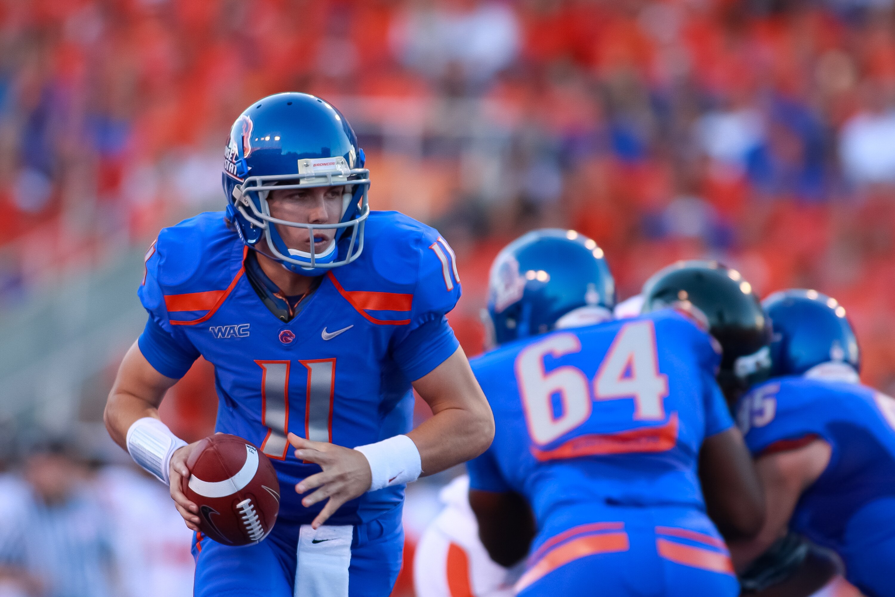 BOISE, ID - SEPTEMBER 25: Quarterback Kellen Moore #11 of the Boise State Broncos looks for a handoff against the Oregon State Beavers at Bronco Stadium on September 25, 2010 in Boise, Idaho. (Photo by Otto Kitsinger III/Getty Images) BOISE, ID - SEPTEMBER 25: Quarterback Kellen Moore #11 of the Boise State Broncos looks for a handoff against the Oregon State Beavers at Bronco Stadium on September 25, 2010 in Boise, Idaho. (Photo by Otto Kitsinger III/Getty Images)