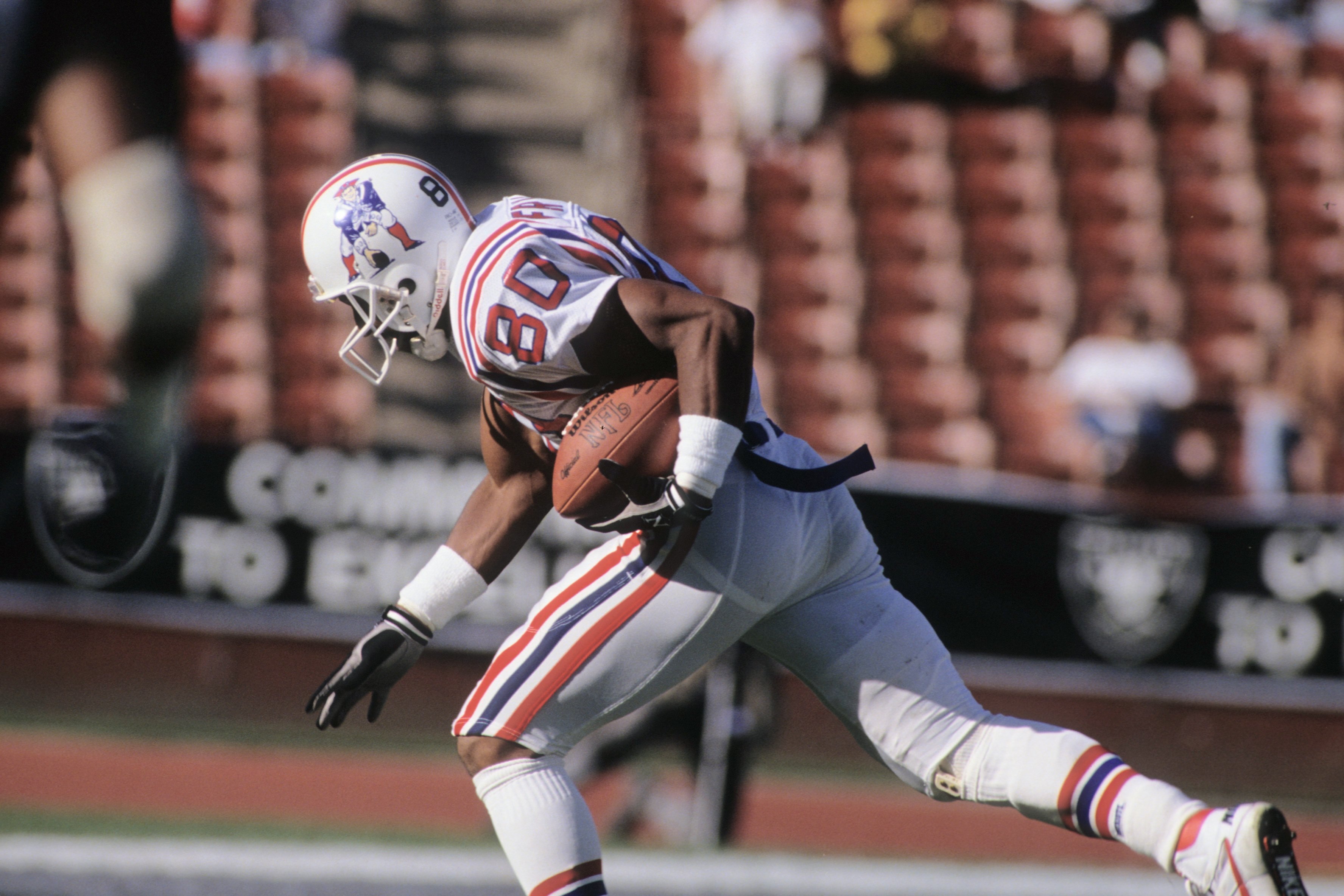 LOS ANGELES, CA - NOVEMBER 26:  Irving Fryar #80 of New England Patriots runs with the ball during the game against the Los Angeles Raiders at the Los Angeles Memorial Coliseum on November 26, 1989 in Los Angeles, California.  The Raiders won 24-21.  (Pho