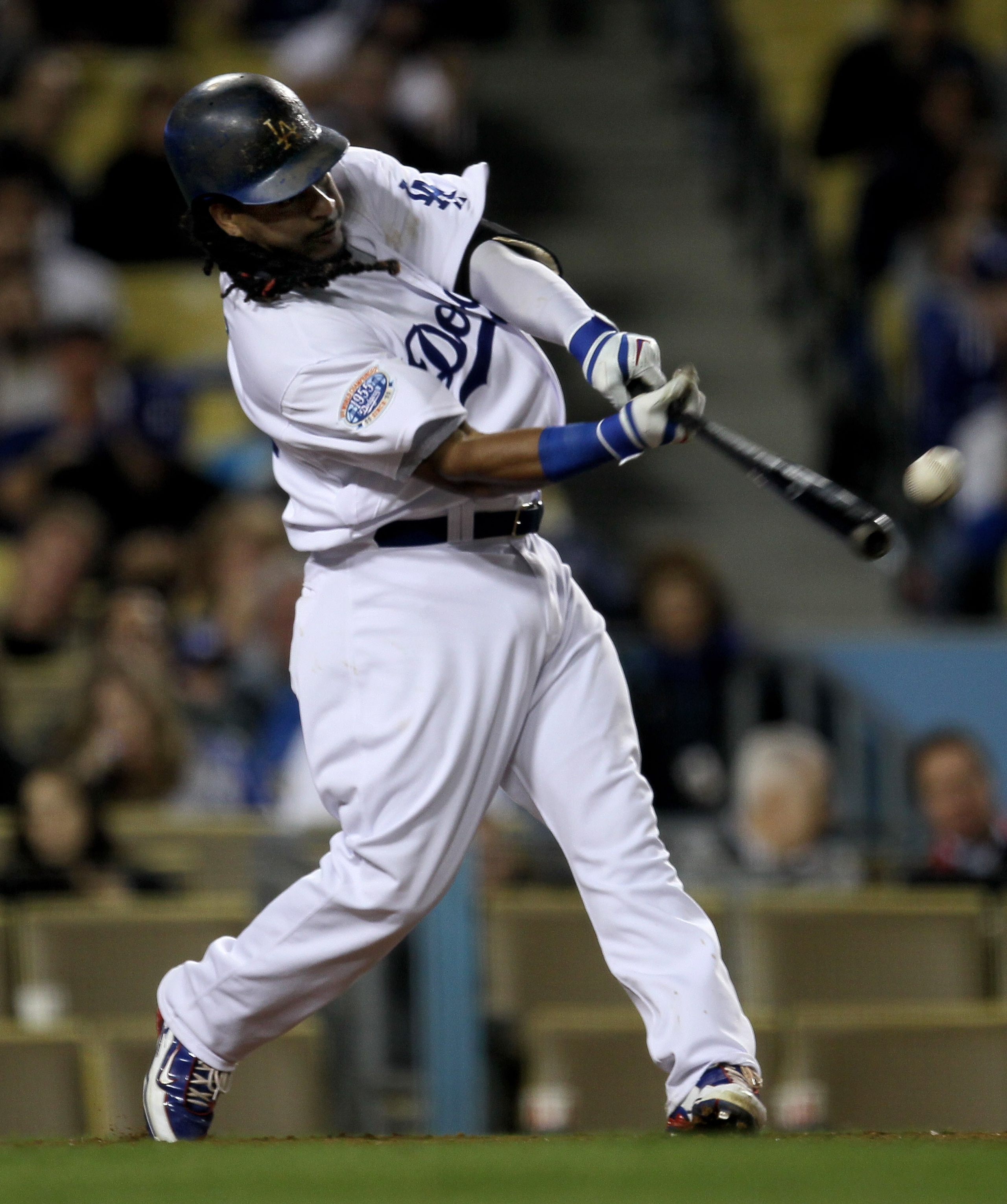 LOS ANGELES - MAY 8: Manny Ramirez #99 of the Los Angeles Dodgers singles in the eighth inning against the Colorado Rockies in his first game since coming off the disabled list on May 8, 2010 at Dodger Stadium in Los Angeles, California.  (Photo by Stephe