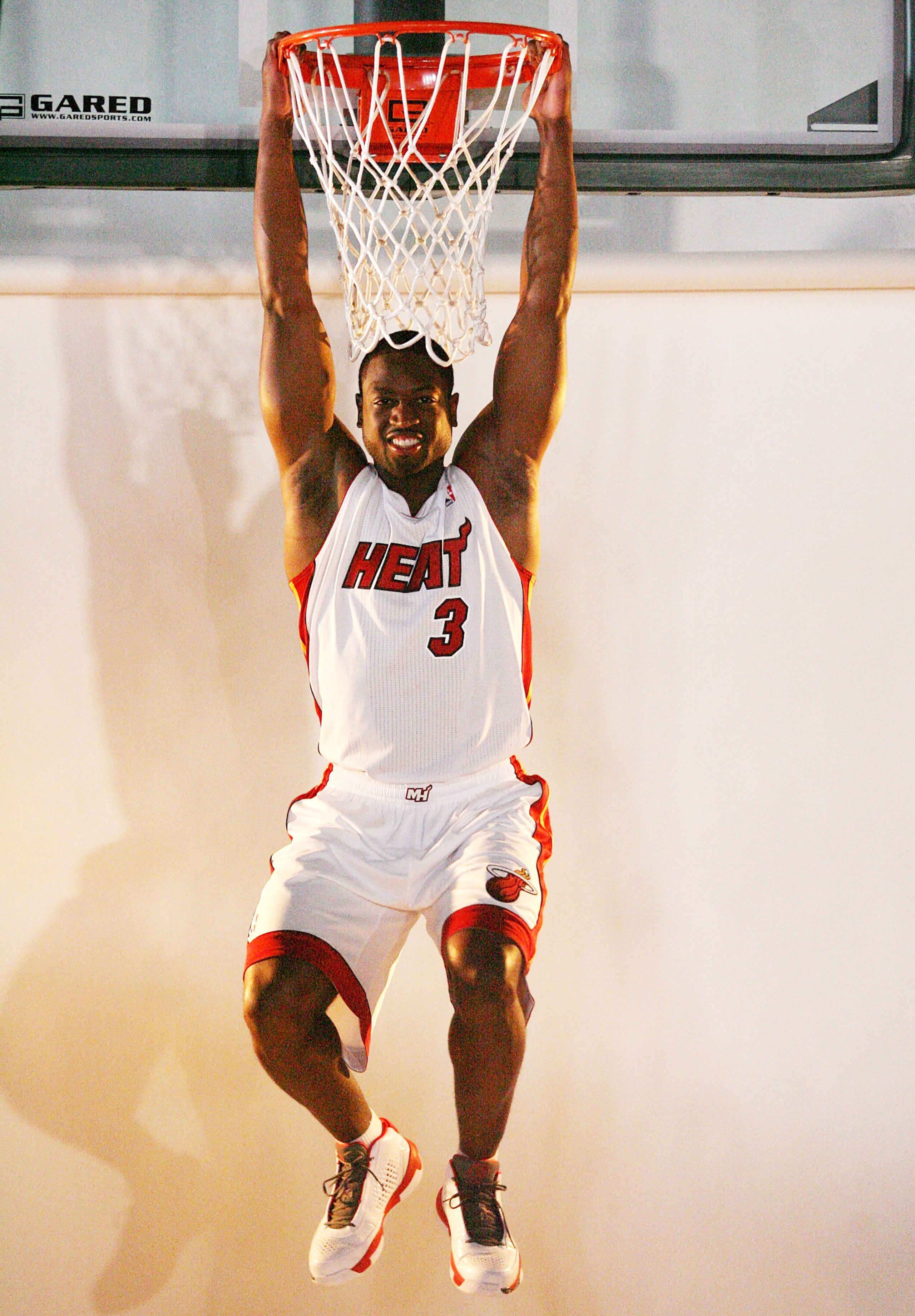 MIAMI - SEPTEMBER 27: Dwyane Wade #3 of the Miami Heat pose for photos during media day at the Bank United Center on September 27, 2010 in Miami, Florida. (Photo by Marc Serota/Getty Images) MIAMI - SEPTEMBER 27: Dwyane Wade #3 of the Miami Heat pose for photos during media day at the Bank United Center on September 27, 2010 in Miami, Florida. (Photo by Marc Serota/Getty Images)
