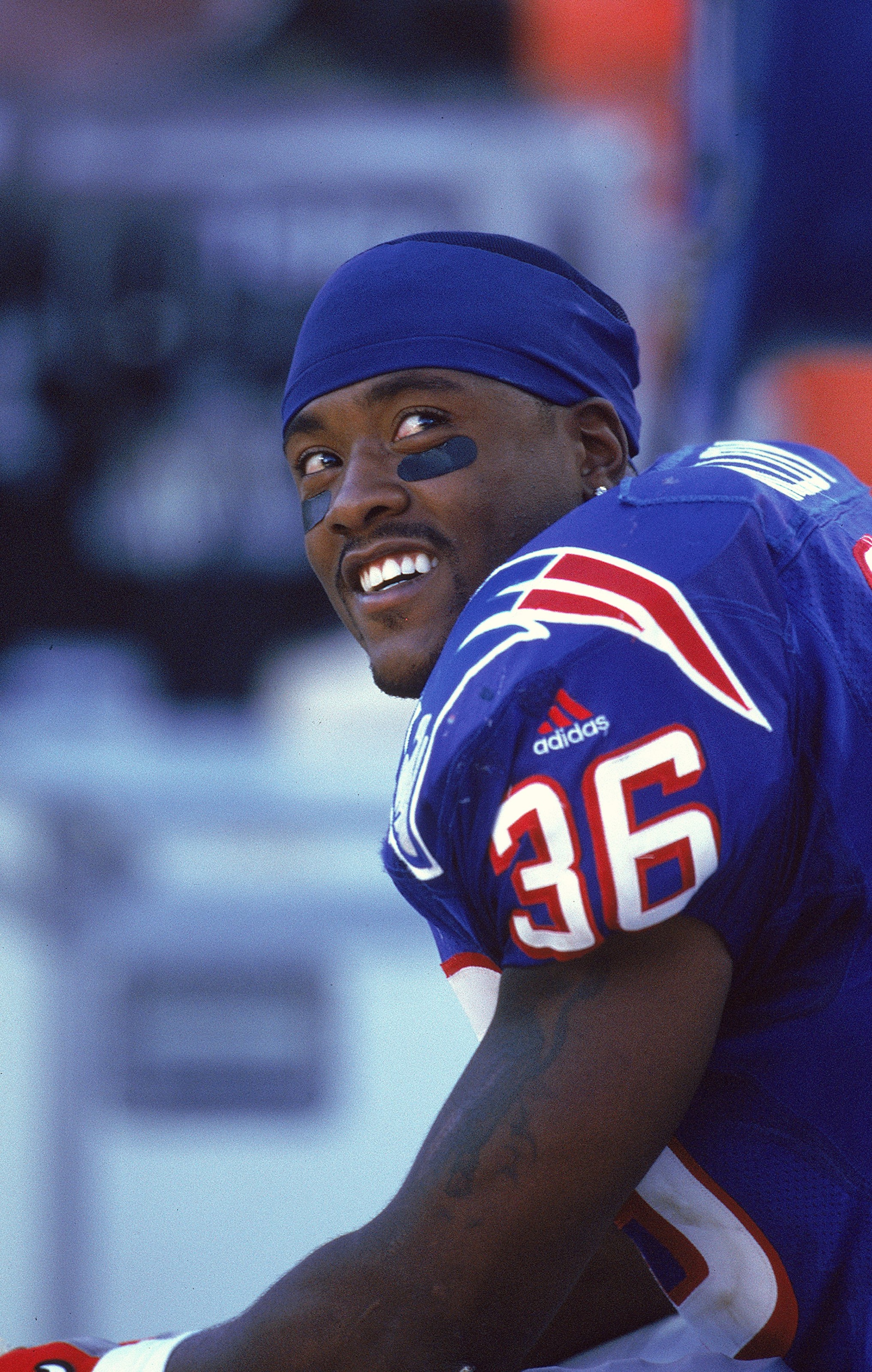 31 Oct 1999: Lawyer Milloy #36 of the New England Patriots smiles as he sits on the bench during the game against the Arizona Cardinals at the Sun Devil Stadium in Tempe, Arizona. The Patriots defeated the Cardinals 27-3. Mandatory Credit: Tom Hauck  /All