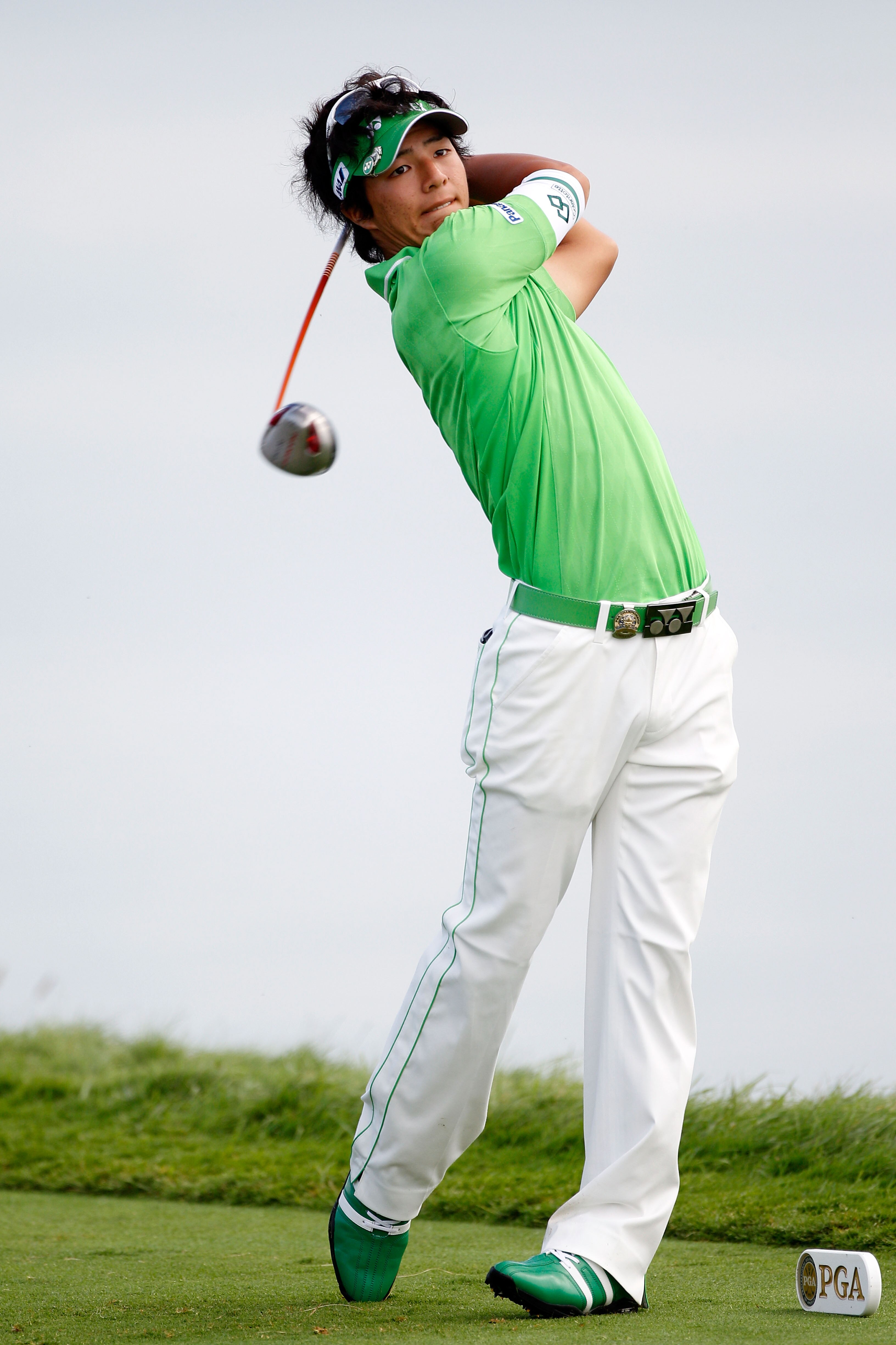 KOHLER, WI - AUGUST 14:  Ryo Ishikawa of Japan hits his tee shot on the 16th hole during the continuation of the second round of the 92nd PGA Championship on the Straits Course at Whistling Straits on August 14, 2010 in Kohler, Wisconsin.  (Photo by Chris