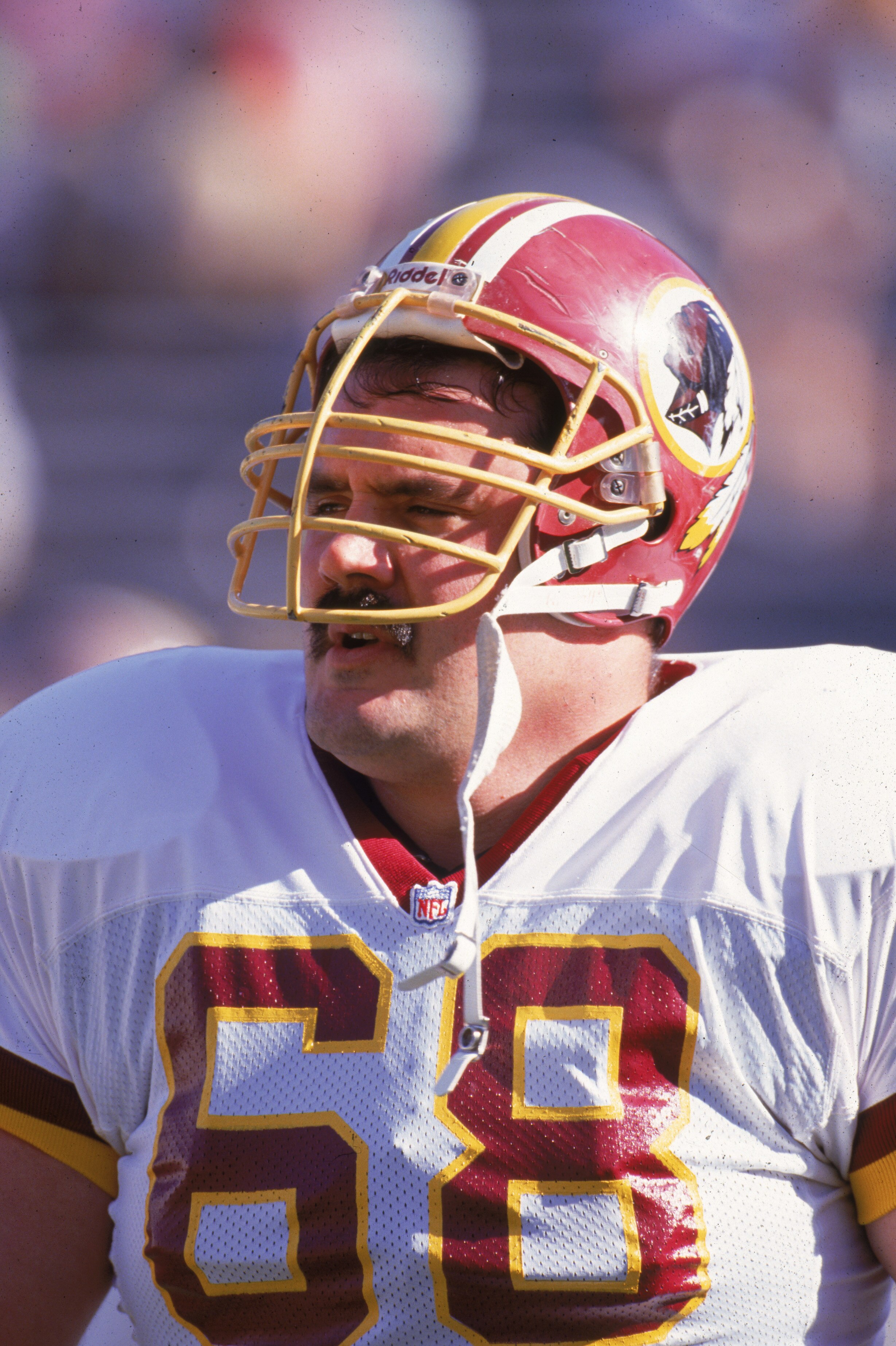 PHOENIX - DECEMBER 8:  Offensive linebacker Russ Grimm #68 of the Washington Redskins stands on the sideline during a game against the Phoenix Cardinals on December 8, 1991 at Sun Devil Stadium in Phoenix, Arizona. (Photo by Mike Powell/Getty Images)