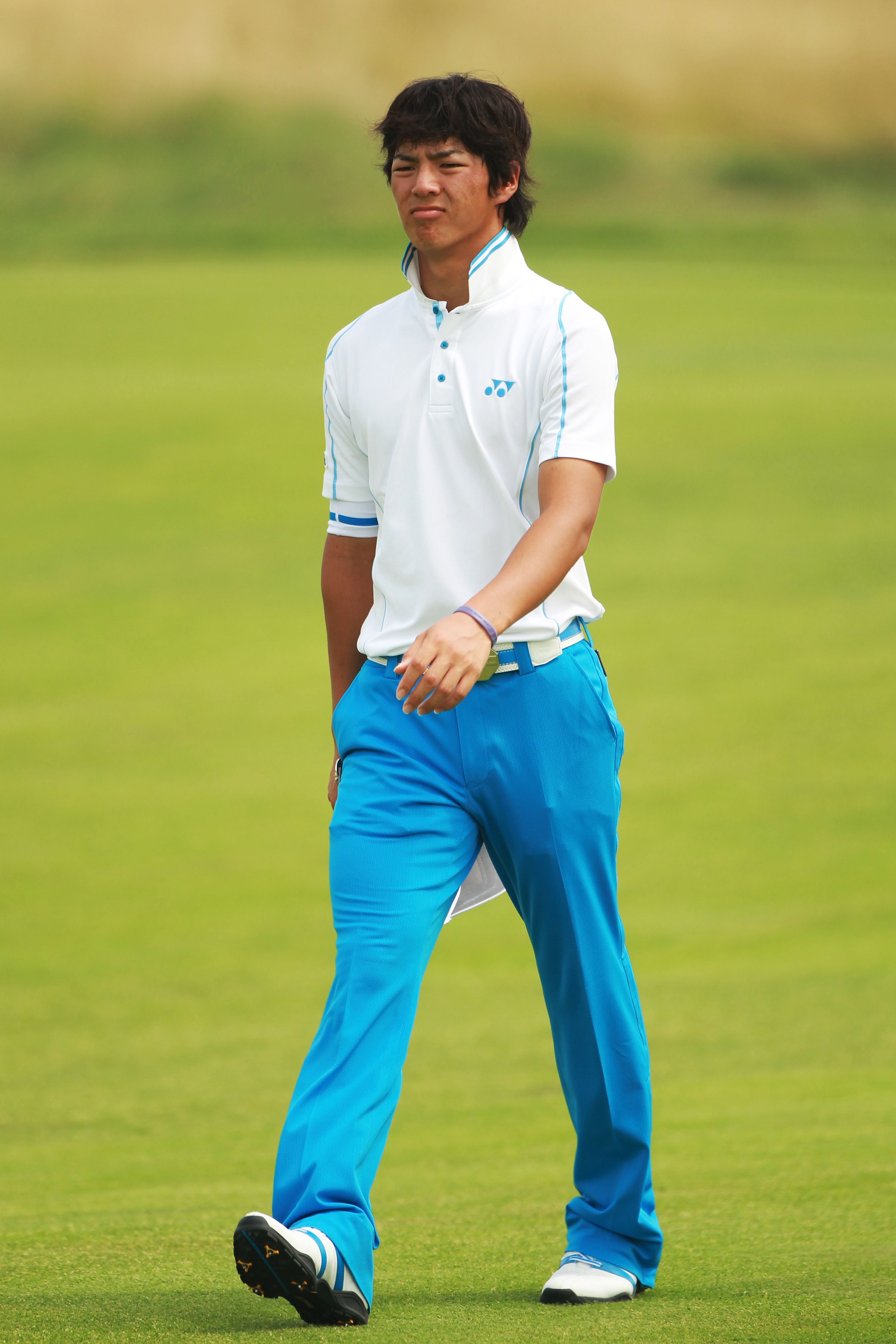 KOHLER, WI - AUGUST 10:  Ryo Ishikawa of Japan walks down a fairway during a practice round prior to the start of the 92nd PGA Championship on the Straits Course at Whistling Straits on August 10, 2010 in Kohler, Wisconsin.  (Photo by Andrew Redington/Get