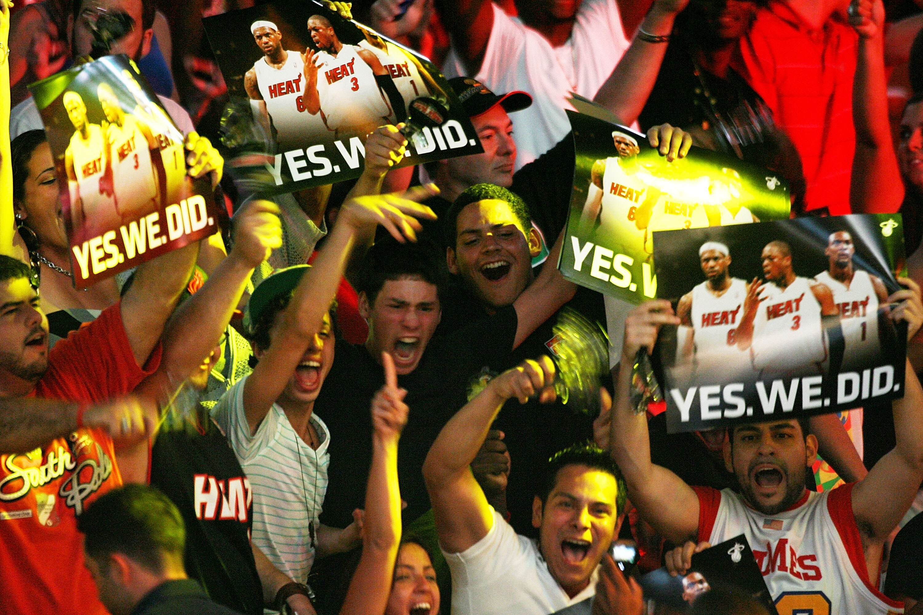 MIAMI - JULY 09:  Fans cheer as Chris Bosh #1, Dwyane Wade #3, and LeBron James #6 of the Miami Heat are introduced during a welcome party at American Airlines Arena on July 9, 2010 in Miami, Florida.  (Photo by Marc Serota/Getty Images)