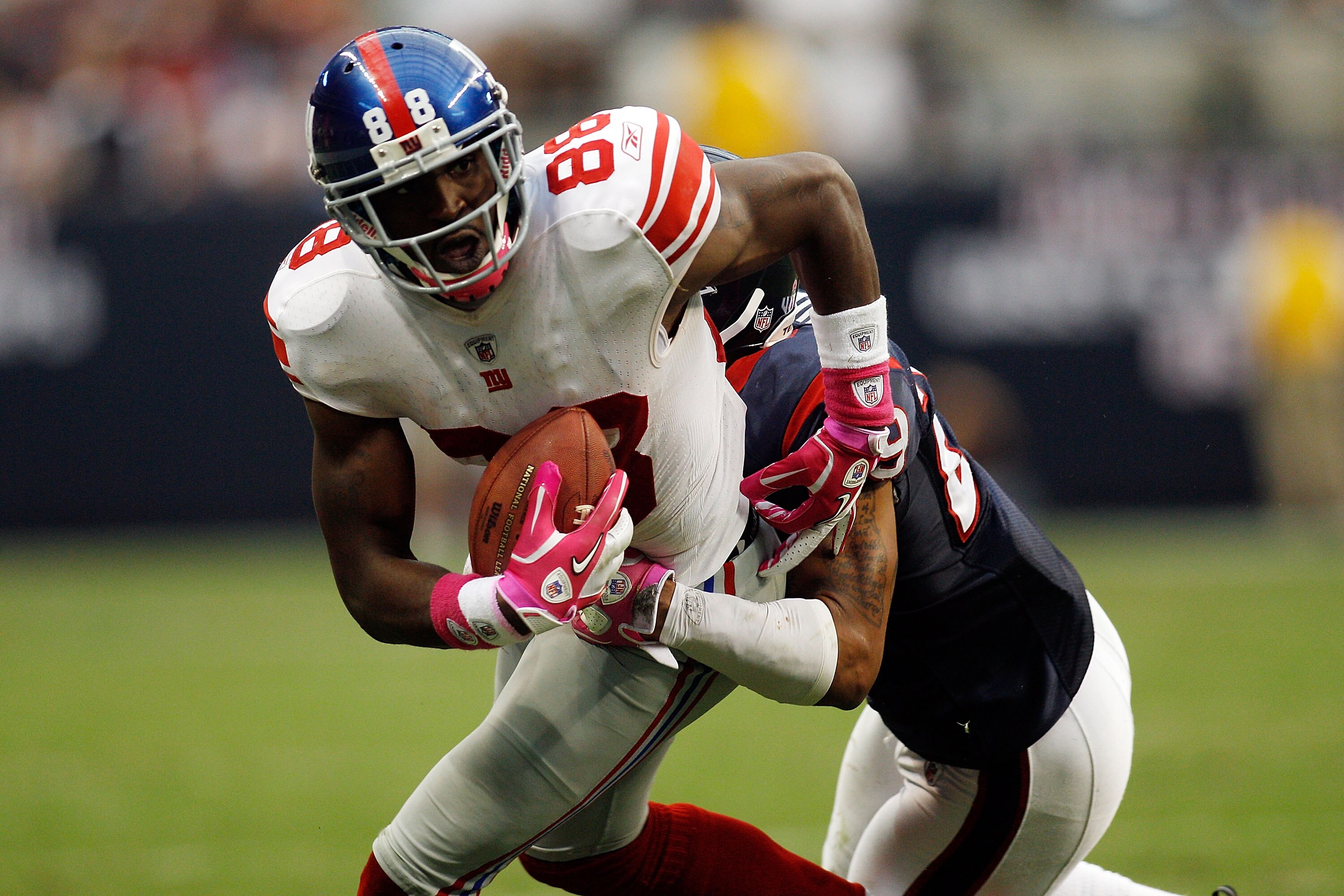 HOUSTON - OCTOBER 10:  Hakeem Nicks #88 of the New York Giants is tackled by Glover Quin #29 of the Houston Texans at Reliant Stadium on October 10, 2010 in Houston, Texas.  (Photo by Chris Graythen/Getty Images)