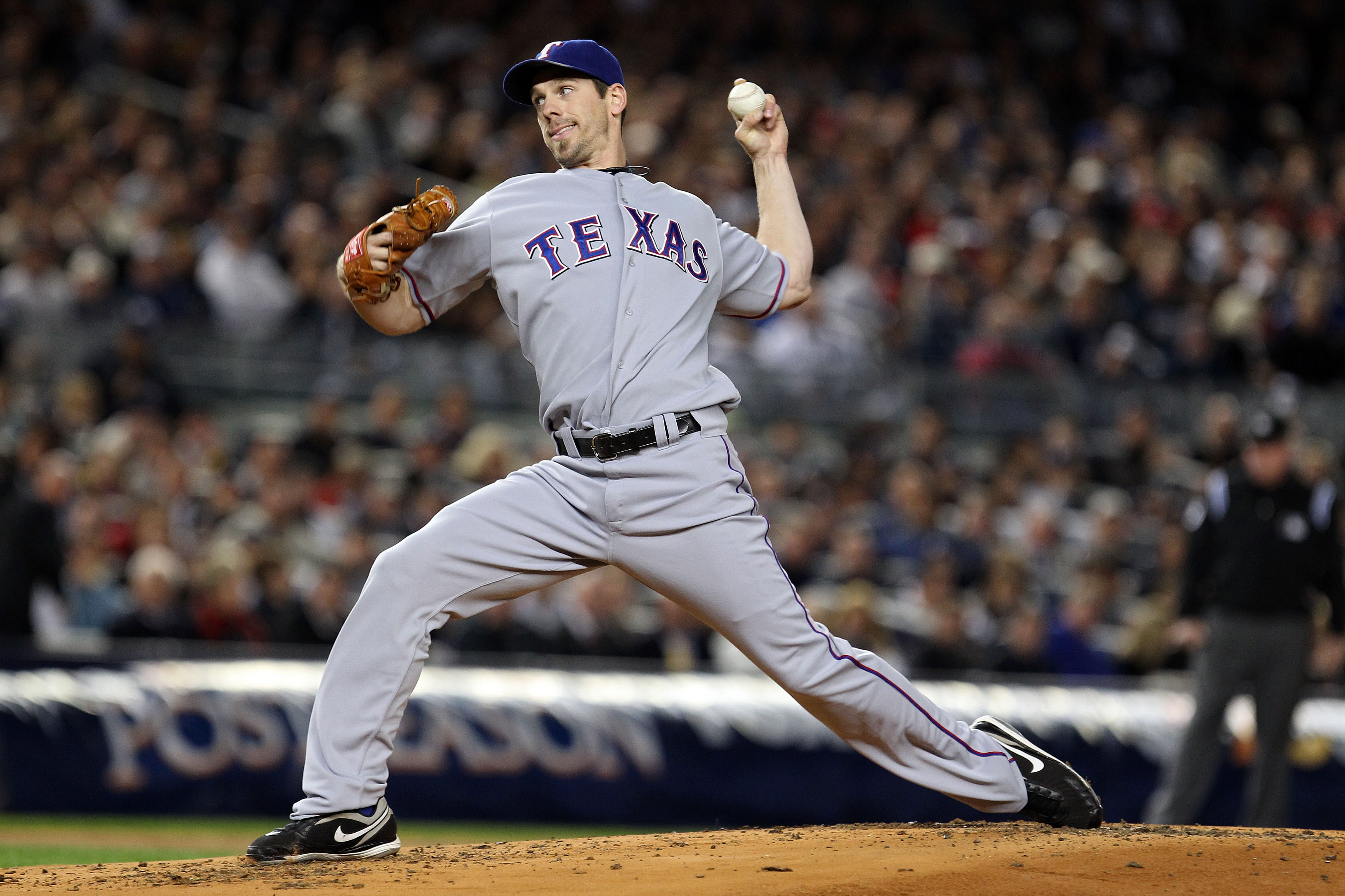 NEW YORK - OCTOBER 18:  Cliff Lee #33 of the Texas Rangers throws a pitch against the New York Yankees in Game Three of the ALCS during the 2010 MLB Playoffs at Yankee Stadium on October 18, 2010 in New York, New York.  (Photo by Al Bello/Getty Images)