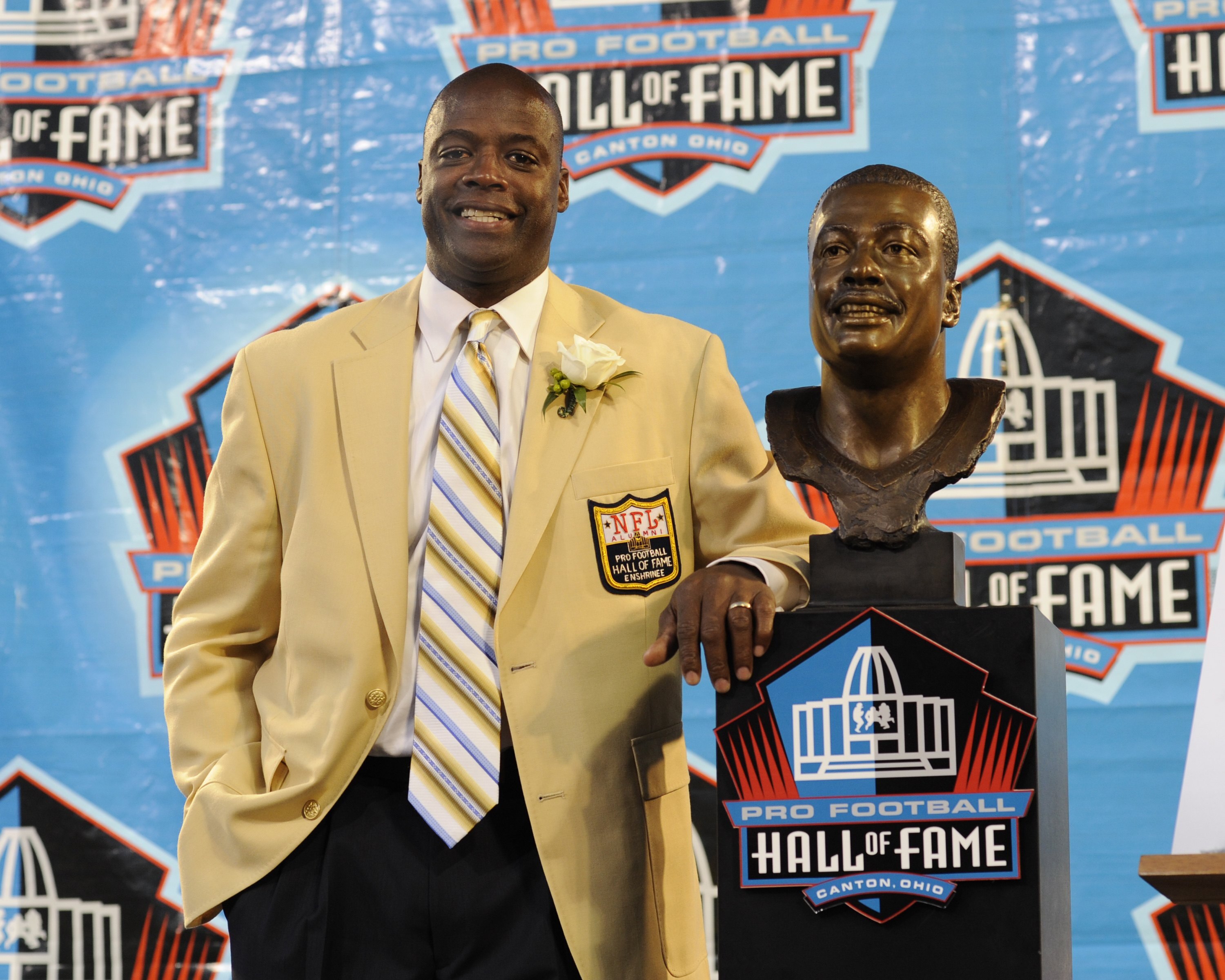 CANTON, OH - AUGUST 2: Darrell Green of the Washington Redskins poses with his bust after his induction during the Class of 2008 Pro Football Hall of Fame Enshrinement Ceremony at Fawcett Stadium on August 2, 2008 in Canton, Ohio.   (Photo by Al Messersch