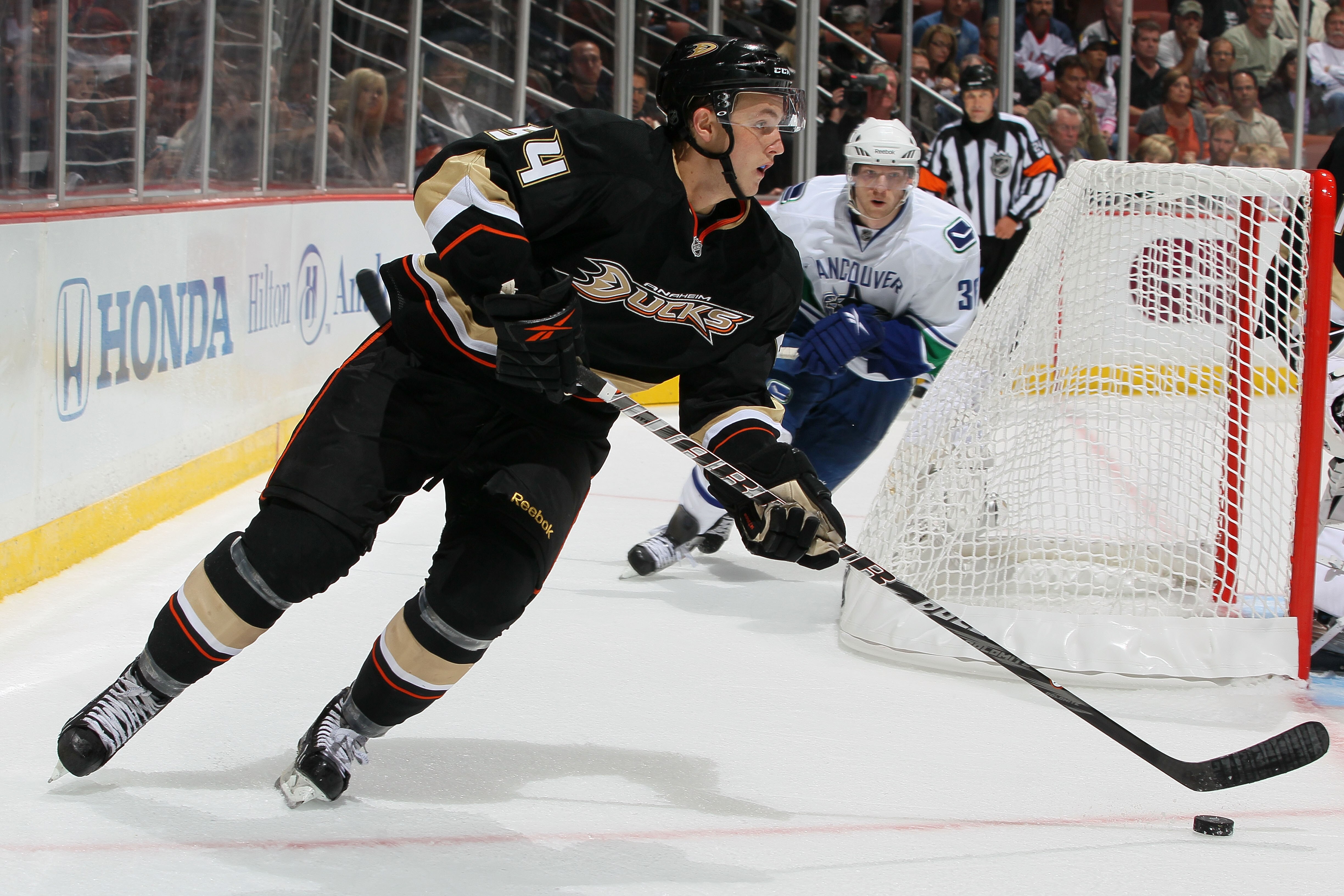 ANAHEIM, CA - OCTOBER 13:  Cam Fowler #54 of the Anaheim Ducks skates with the puck against the Vancouver Canucks during their game at Honda Center on October 13, 2010 in Anaheim, California.  (Photo by Jeff Gross/Getty Images)