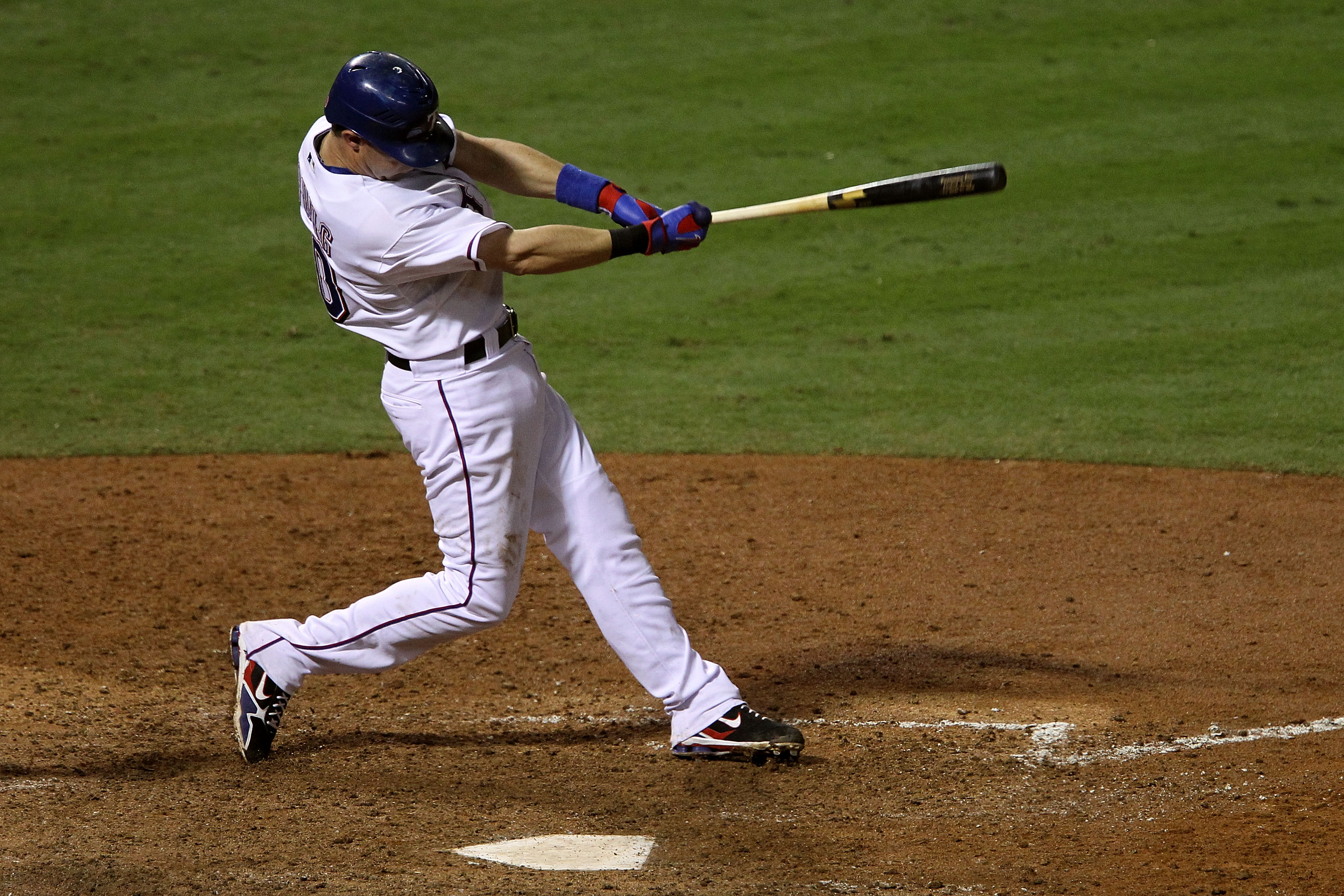 ARLINGTON, TX - OCTOBER 22:  Michael Young #10 of the Texas Rangers hits a double against the New York Yankees in the seventh inning of Game Six of the ALCS during the 2010 MLB Playoffs at Rangers Ballpark in Arlington on October 22, 2010 in Arlington, Te