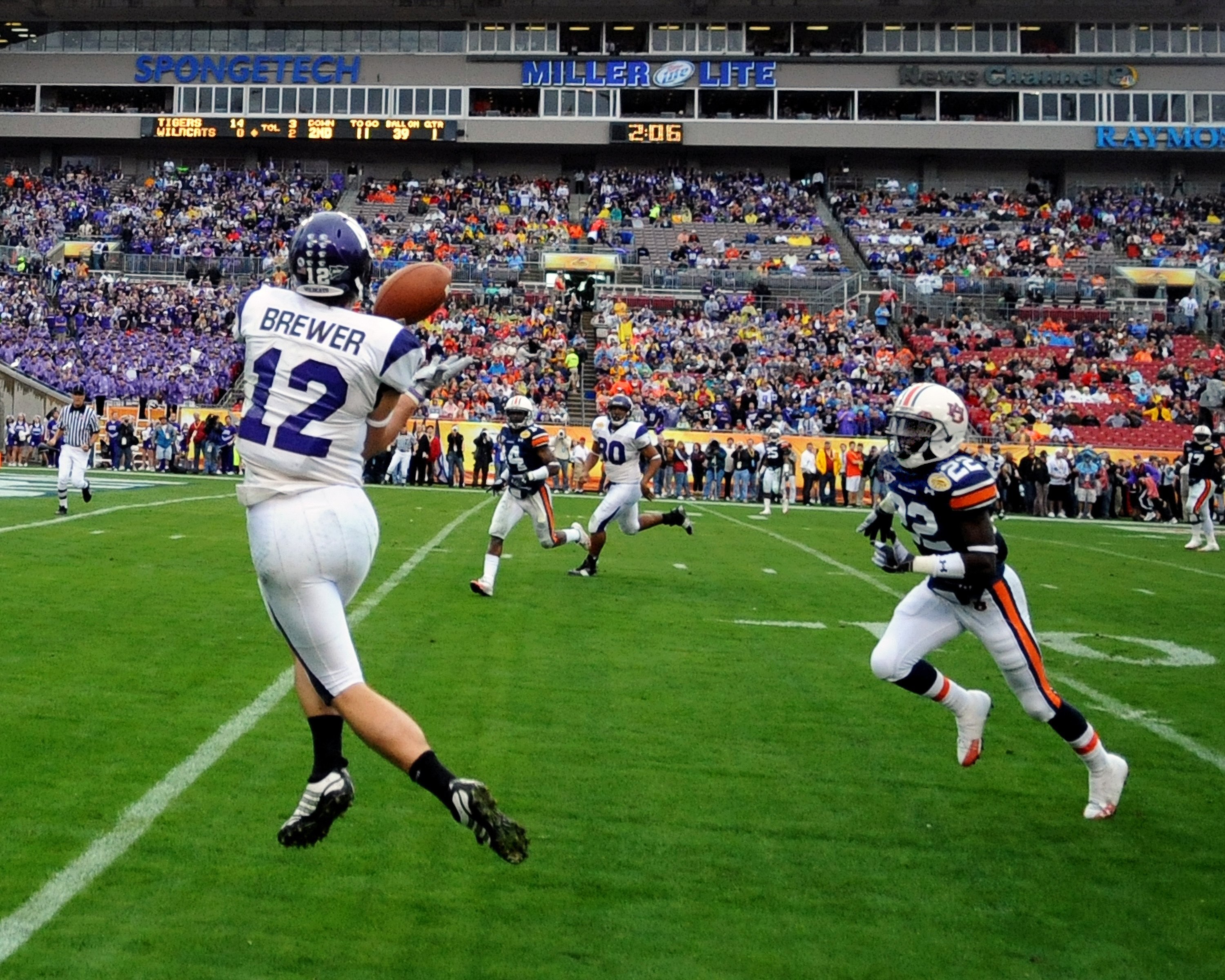 TAMPA, FL - JANUARY 1: Wide receiver Andrew Brewer #12 of the Northwestern Wildcats grabs a touchdown pass against the Auburn Tigers in the Outback Bowl January 1, 2010 at Raymond James Stadium in Tampa, Florida.  (Photo by Al Messerschmidt/Getty Images)