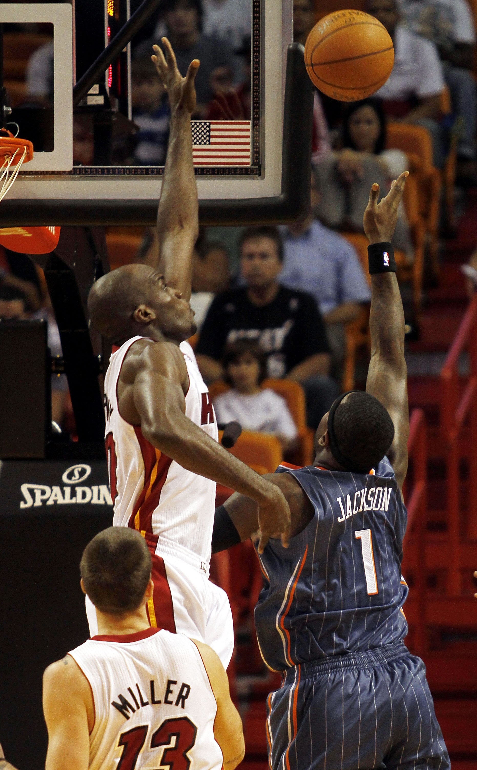 MIAMI - OCTOBER 18:  Center Joel Anthony #50 of the Miami Heat blocks a shot against Forward Stephen Jackson #1 of the Charlotte Bobcats on October 18, 2010 at American Airlines Arena in Miami, Florida. NOTE TO USER: User expressly acknowledges and agrees