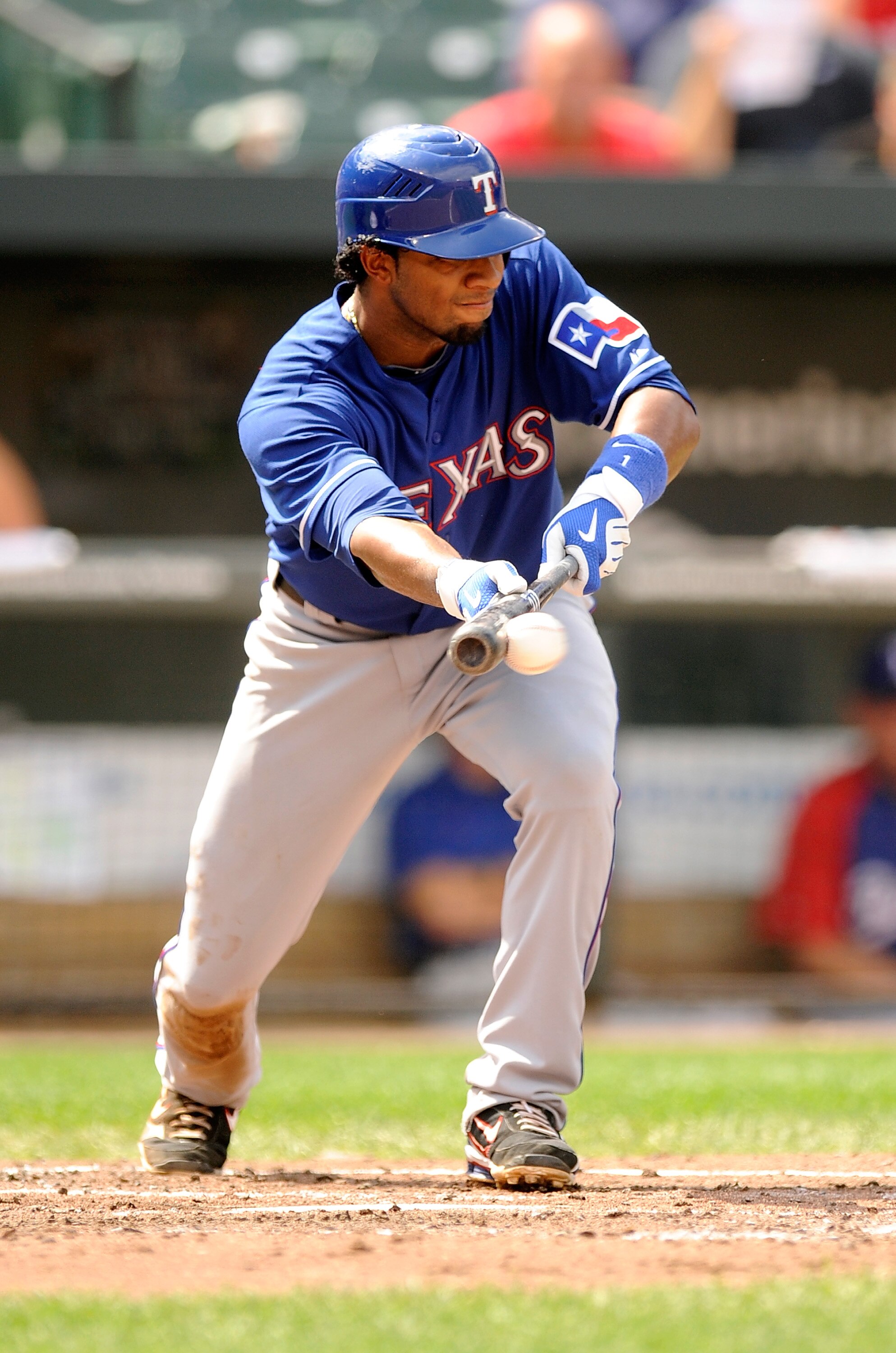 BALTIMORE - AUGUST 22:  Elvis Andrus #1 of the Texas Rangers lays down a bunt against the Baltimore Orioles at Camden Yards on August 22, 2010 in Baltimore, Maryland.  (Photo by Greg Fiume/Getty Images)