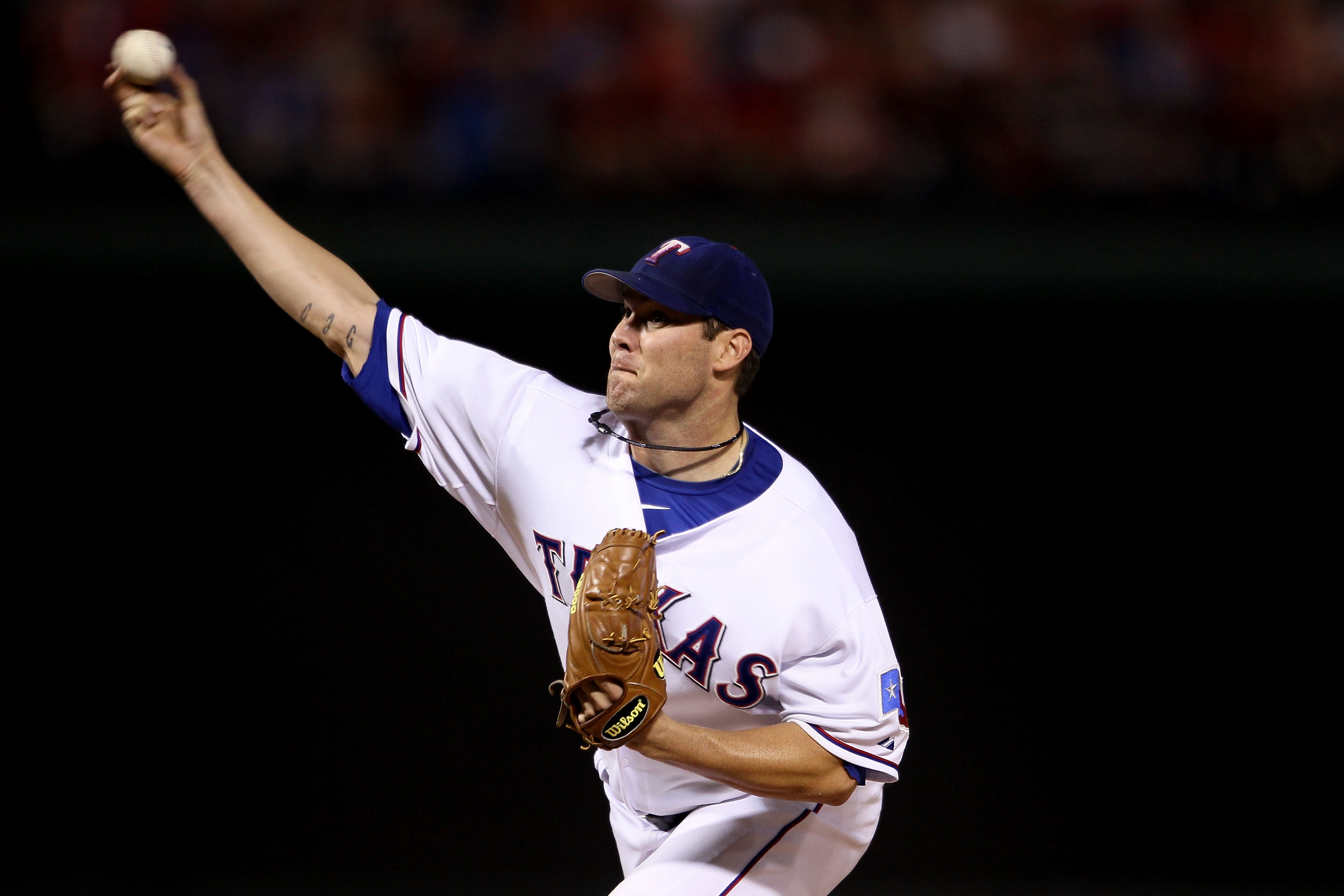 ARLINGTON, TX - OCTOBER 22:  Starting pitcher Colby Lewis #48 of the Texas Rangers pitches against the New York Yankees in Game Six of the ALCS during the 2010 MLB Playoffs at Rangers Ballpark in Arlington on October 22, 2010 in Arlington, Texas. The Rang