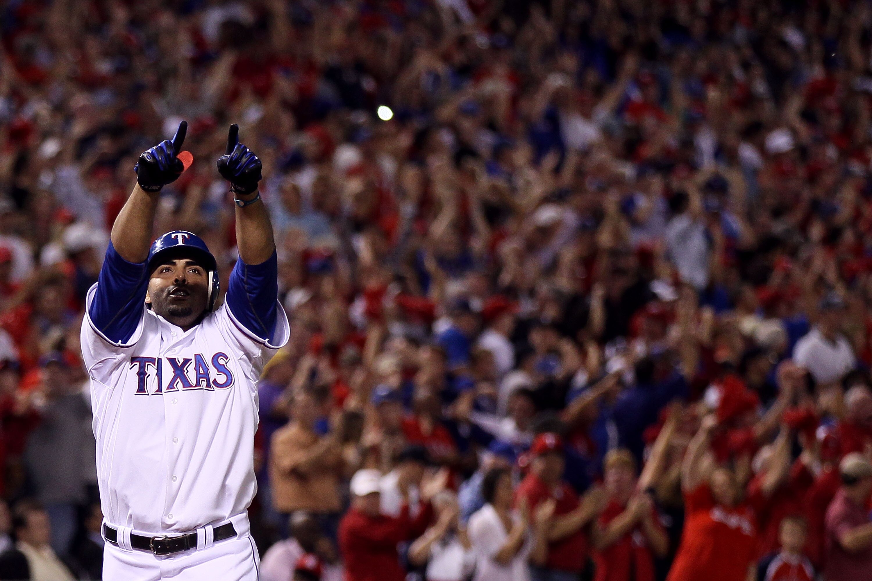 ARLINGTON, TX - OCTOBER 22:  Nelson Cruz #17 of the Texas Rangers celebrates as he crosses home plate and score on his 2-run home run in the bottom of the fifth inning against the New York Yankees in Game Six of the ALCS during the 2010 MLB Playoffs at Ra