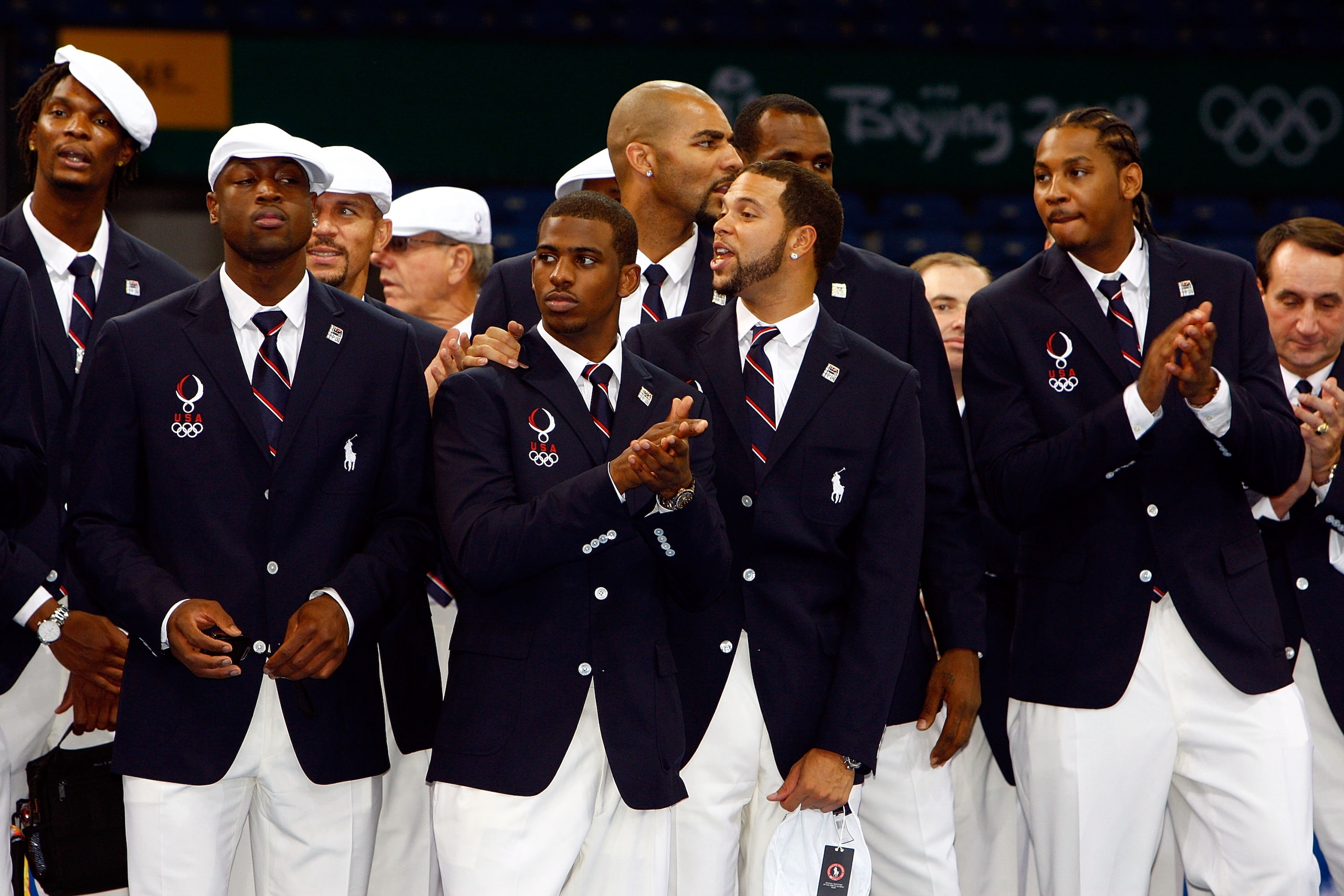 BEIJING - AUGUST 08:  (L-R) Basketball players Chris Bosh, Dwyane Wade, Jason Kidd, Chris Paul, Carlos Boozer, Deron Williams, LeBron James and Carmelo Anthony of the United States look on during visit by US President George W. Bush on the opening day of 
