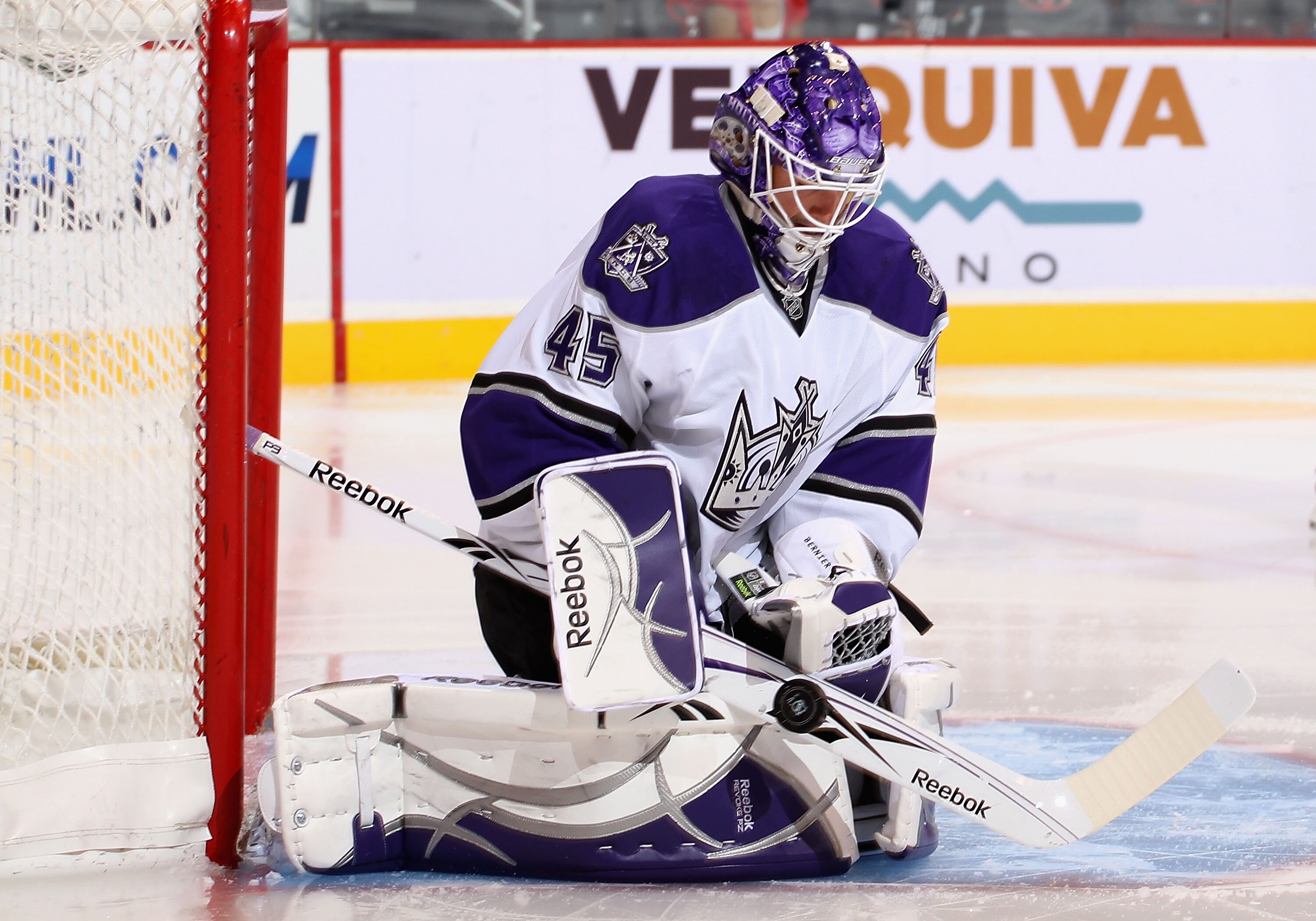 GLENDALE, AZ - SEPTEMBER 23:  Goaltender Jonathan Bernier #45 of the Los Angeles Kings makes a stick save on the shot from the Phoenix Coyotes during the preseason NHL game at Jobing.com Arena on September 23, 2010 in Glendale, Arizona. The Coyotes defeat