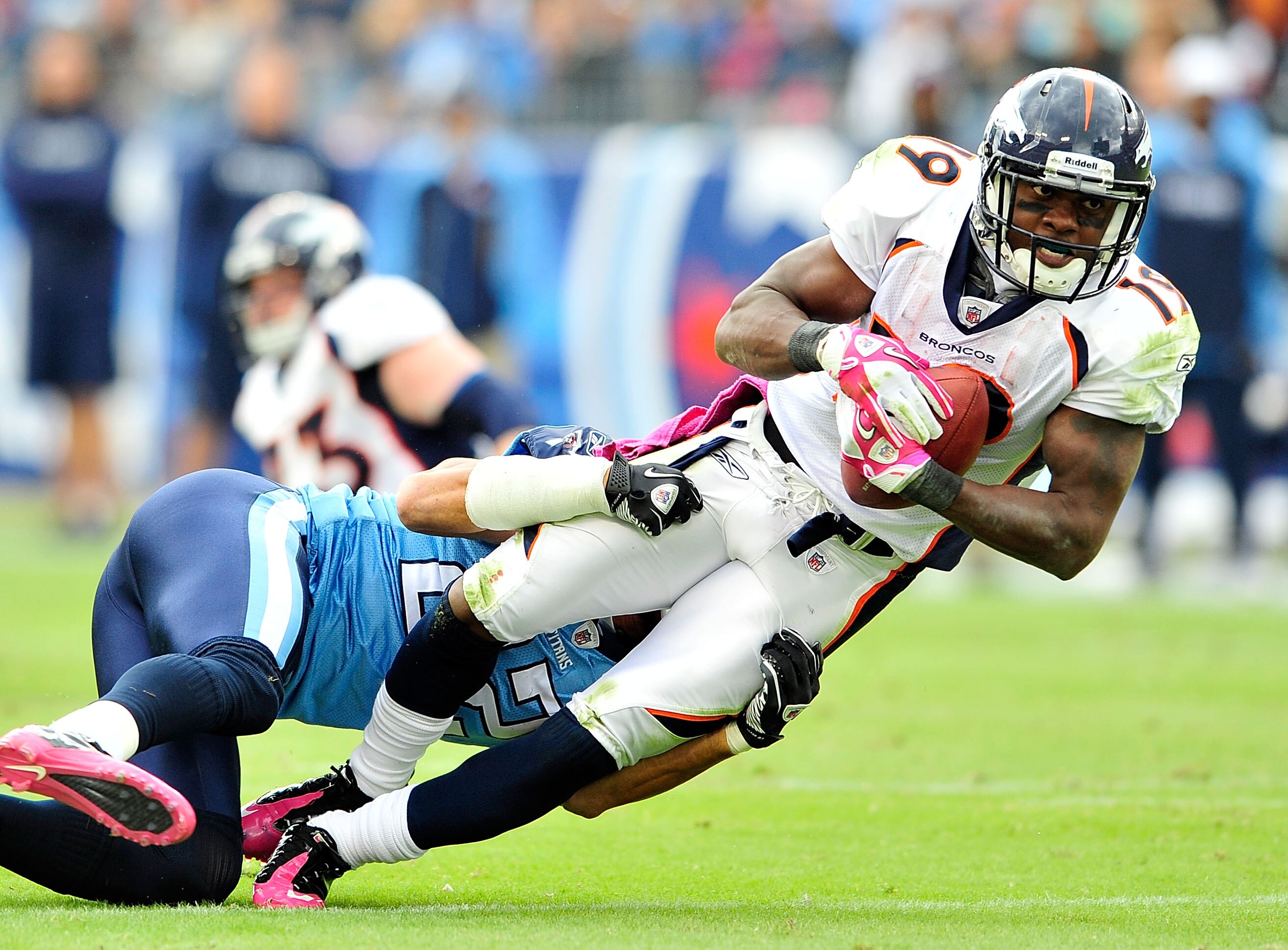 NASHVILLE, TN - OCTOBER 03:  Vincent Fuller #22 of the Tennessee Titans tackles Eddie Royal #19 of the Denver Broncos during the first half at LP Field on October 3, 2010 in Nashville, Tennessee.  (Photo by Grant Halverson/Getty Images)