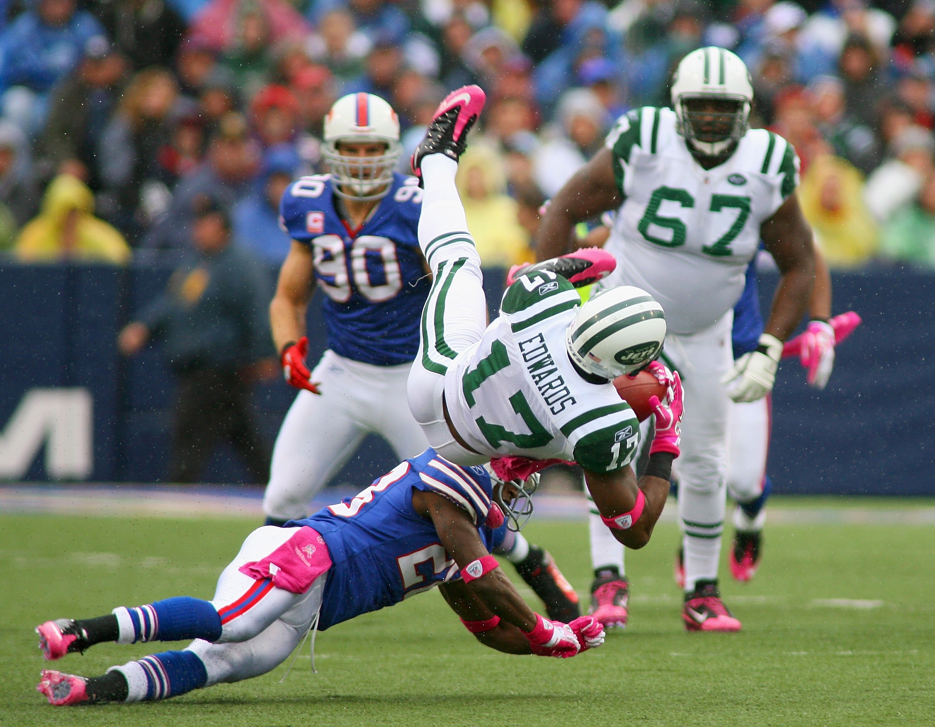 ORCHARD PARK, NY - OCTOBER 03: Braylon Edwards #17 of the New York Jets is upended by Leodis McKelvin #28 of the Buffalo Bills at Ralph Wilson Stadium on October 3, 2010 in Orchard Park, New York. The Jets won 38-14. (Photo by Rick Stewart/Getty Images)