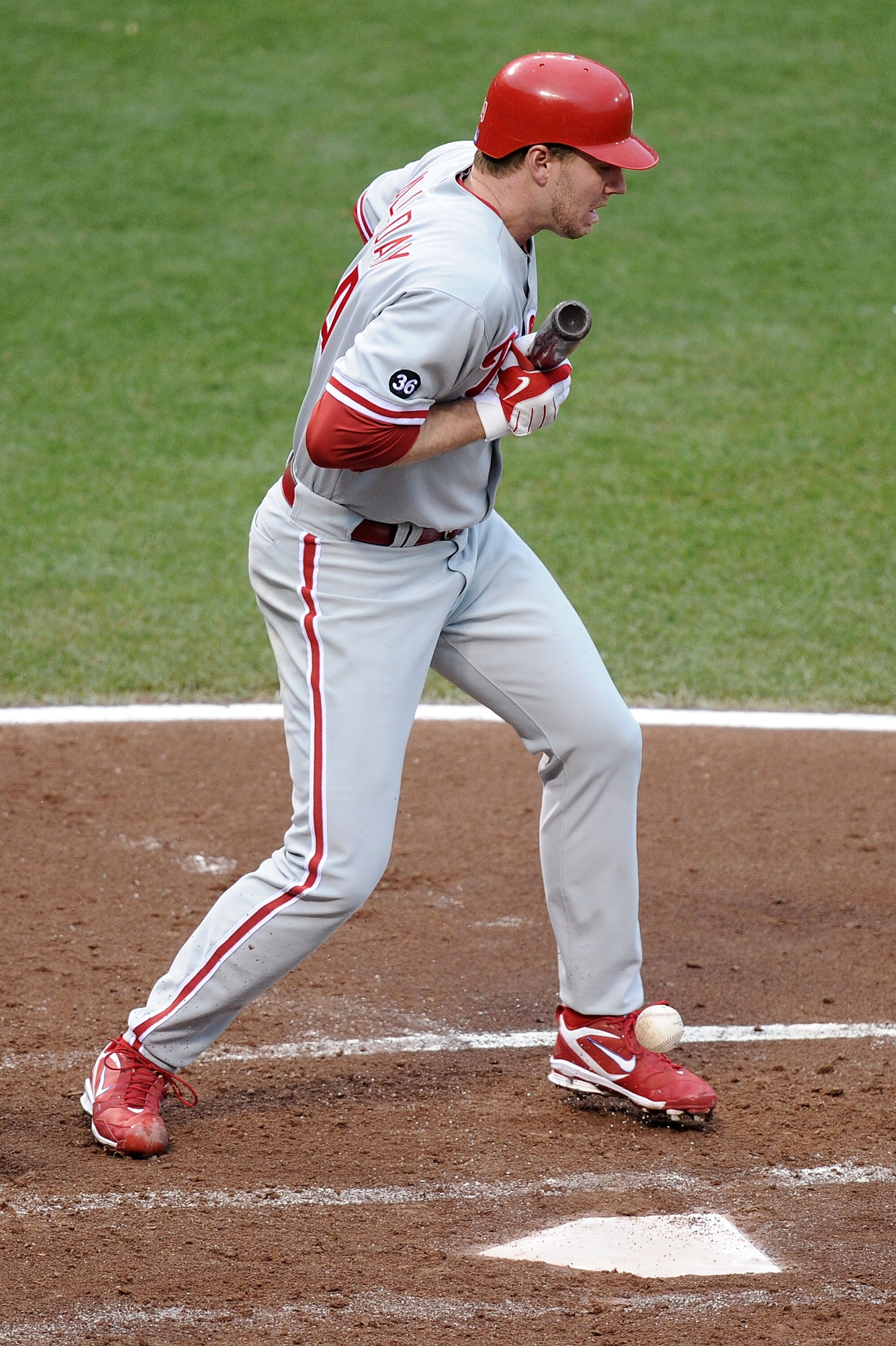SAN FRANCISCO - OCTOBER 21:  Roy Halladay #34 of the Philadelphia Phillies hits a sacrifice bunt against the San Francisco Giants in the third inning of Game Five of the NLCS during the 2010 MLB Playoffs at AT&T Park on October 21, 2010 in San Francisco,