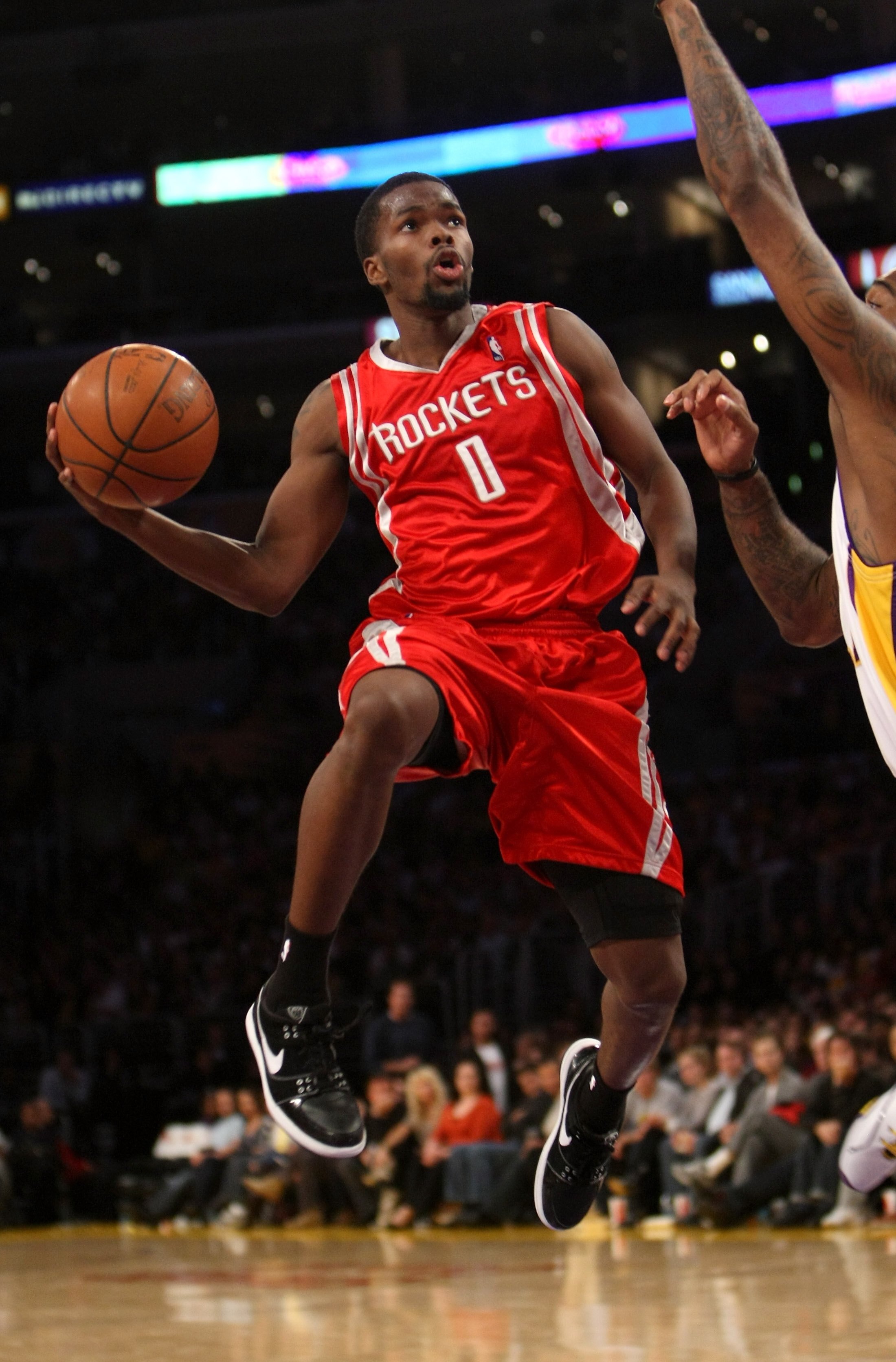LOS ANGELES, CA - NOVEMBER 15:  Aaron Brooks #0 of the Houston Rockets goes up to shoot against the Los Angeles Lakers on November 15, 2009 at Staples Center in Los Angeles, California.  The Rockets won 101-91.  NOTE TO USER: User expressly acknowledges a