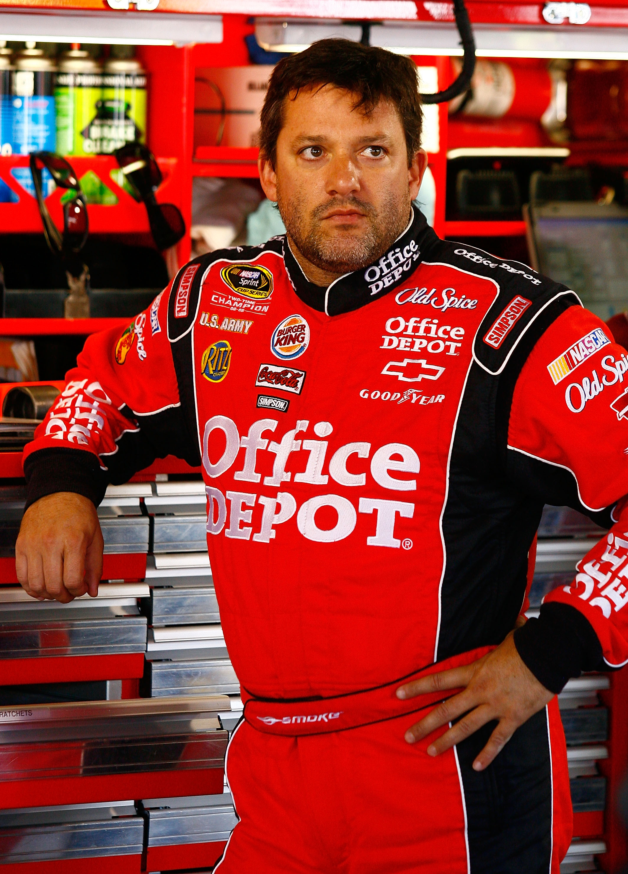 MARTINSVILLE, VA - OCTOBER 22:  Tony Stewart, driver of the #14 Old Spice/Office Depot Chevrolet, stands in the garage during practice for the NASCAR Sprint Cup Series TUMS Fast Relief 500 at Martinsville Speedway on October 22, 2010 in Martinsville, Virg