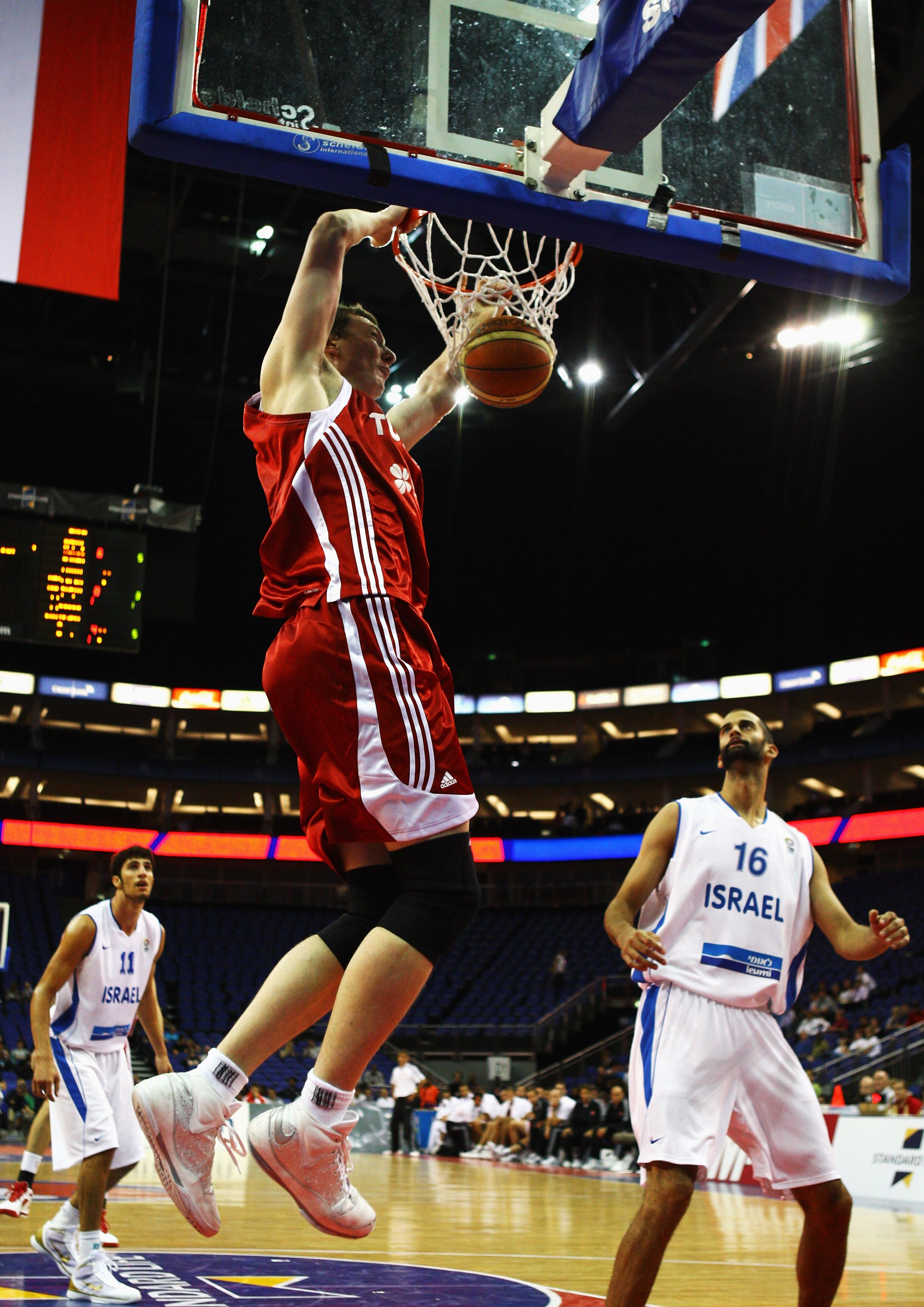 LONDON, ENGLAND - AUGUST 14: Omer Asik of Turkey slam dunks during the game between Turkey and Israel as part of the Game On event at the O2 Arena on August 14, 2009 in London, England.  (Photo by Paul Gilham/Getty Images)