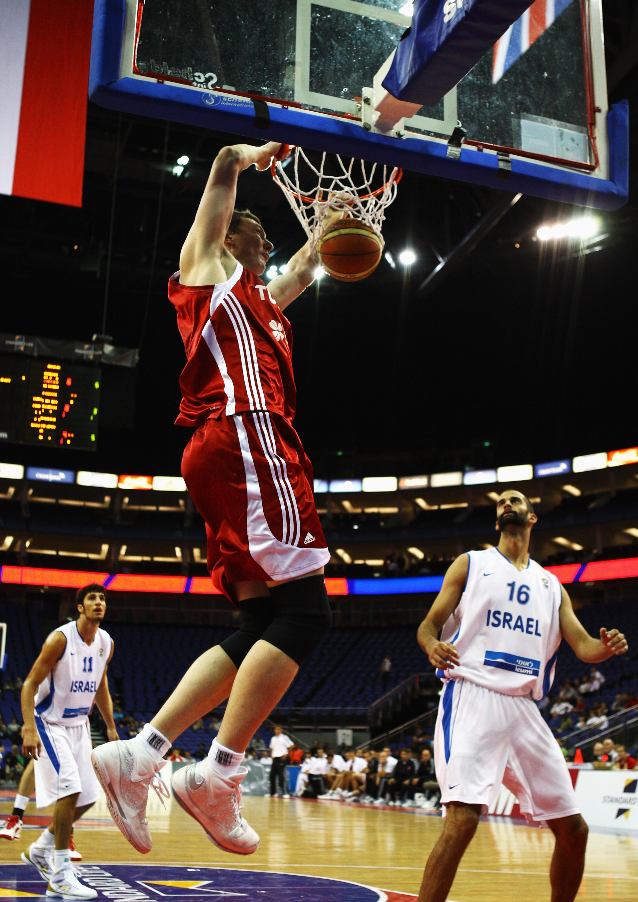 LONDON, ENGLAND - AUGUST 14: Omer Asik of Turkey slam dunks during the game between Turkey and Israel as part of the Game On event at the O2 Arena on August 14, 2009 in London, England.  (Photo by Paul Gilham/Getty Images)