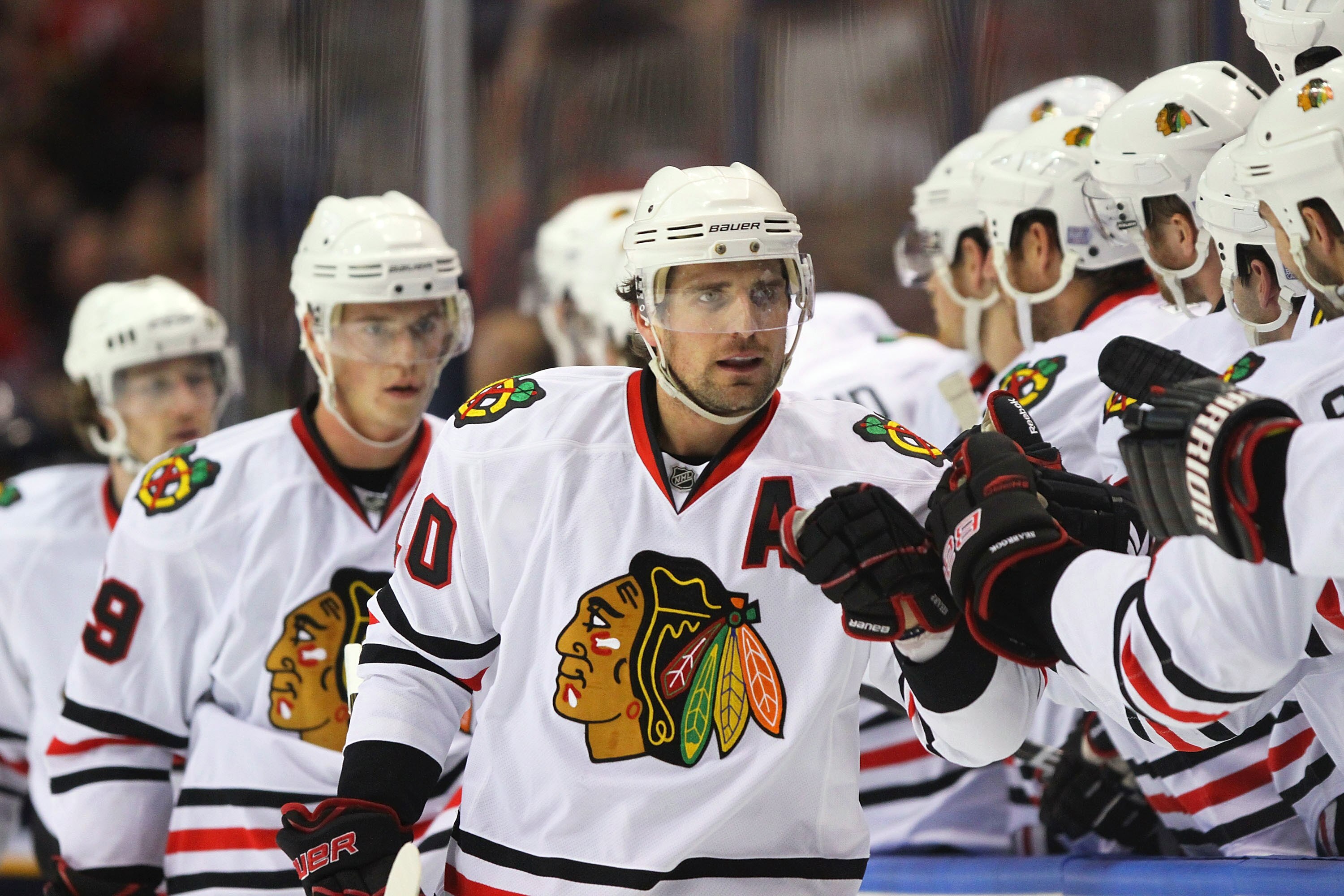 ST. LOUIS - OCTOBER 22: Patrick Sharp #10 of the Chicago Blackhawks is congratulated by teammates after scoring a goal against the St. Louis Blues at the Scottrade Center on October 22, 2010 in St. Louis, Missouri.  (Photo by Dilip Vishwanat/Getty Images)