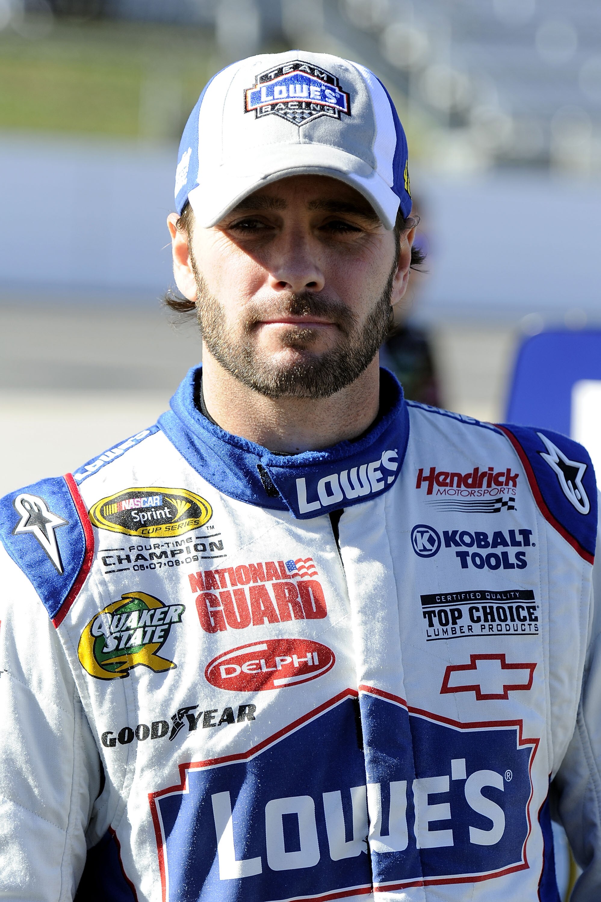 MARTINSVILLE, VA - OCTOBER 22:  Jimmie Johnson, driver of the #48 Lowe's Chevrolet, walks on pit road during qualifying for the NASCAR Sprint Cup Series TUMS Fast Relief 500 at Martinsville Speedway on October 22, 2010 in Martinsville, Virginia.  (Photo b