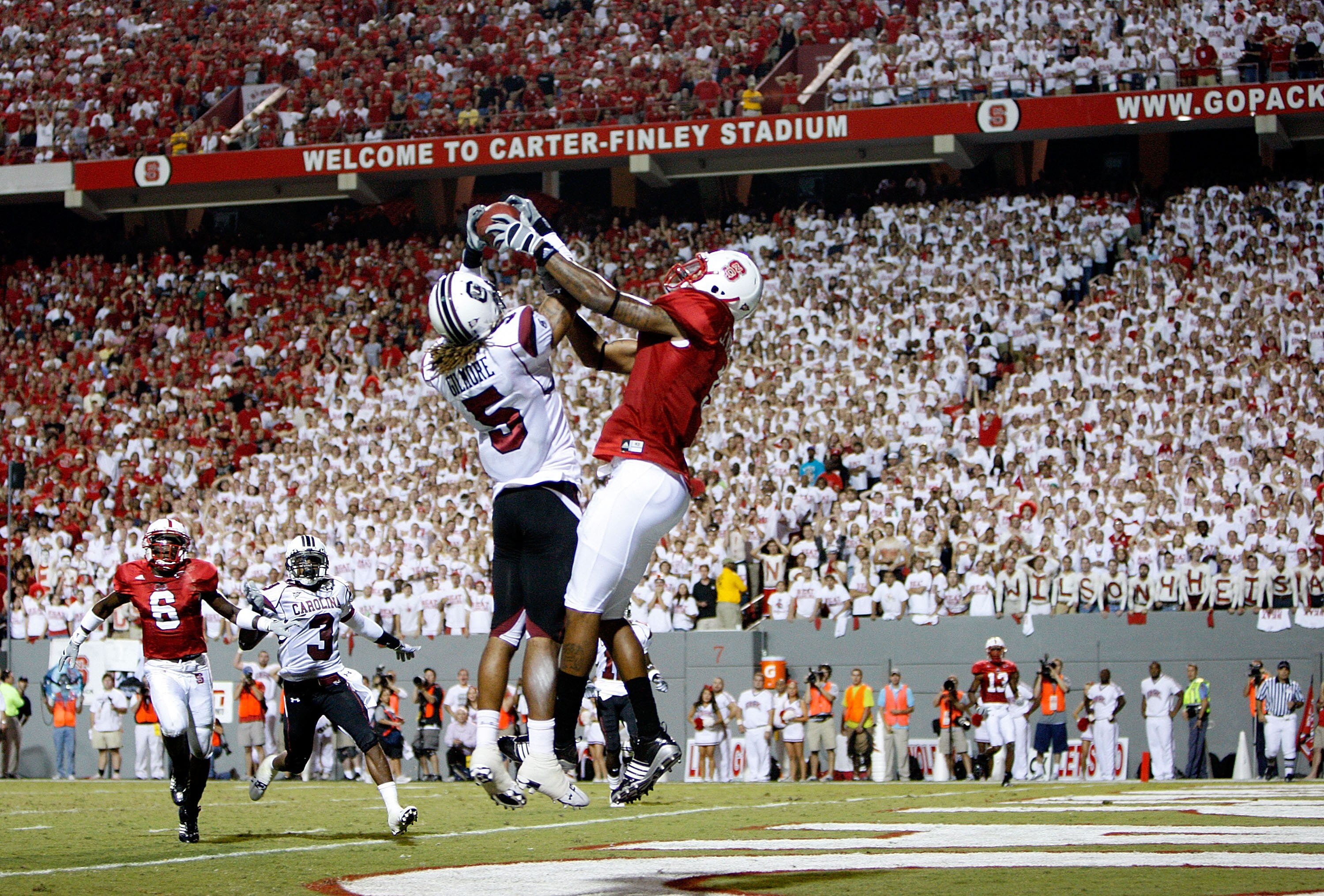 RALEIGH, NC - SEPTEMBER 3:  Stephon Gilmore #5 of the South Carolina Gamecocks knocks down the ball against Jarvis Williams #5 of the North Carolina State Wolfpack that seal a 7-3 victory for the Gamecocks during their game at Carter-Finley Stadium on Sep