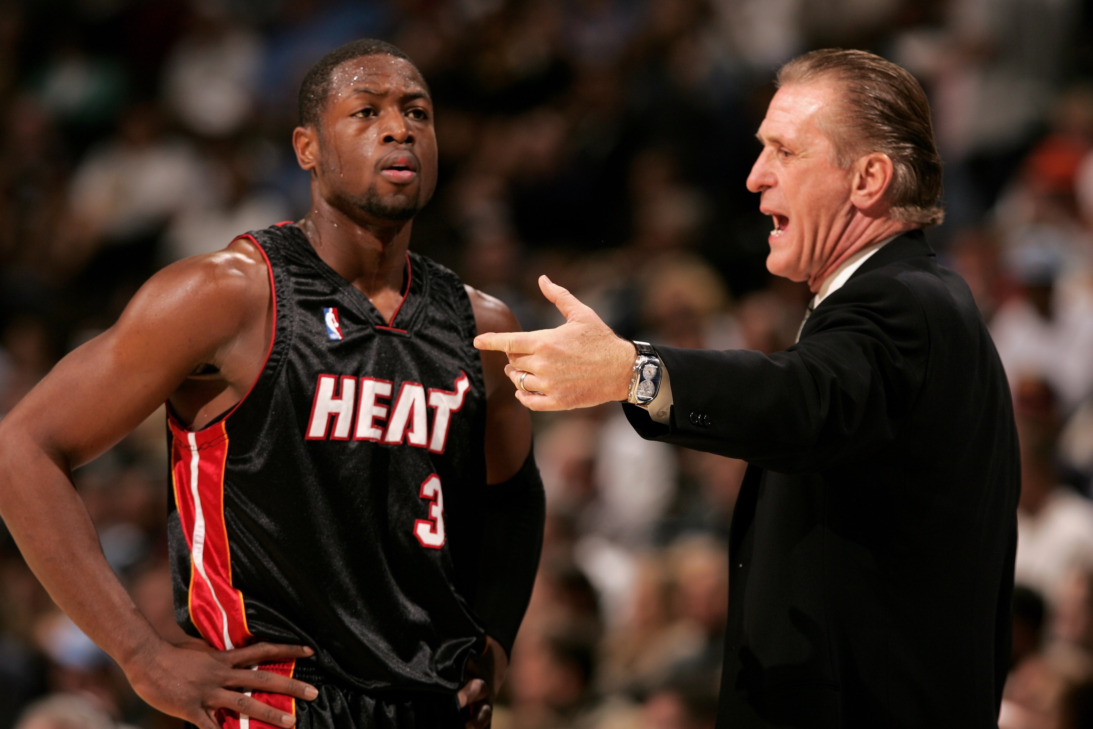 DENVER - DECEMBER 08:  Head coach Pat Riley talks with Dwyane Wade #3 of the Miami Heat as they face the Denver Nuggets on December 8, 2006 at the Pepsi Center in Denver, Colorado. NOTE TO USER: User expressly acknowledges and agrees that, by downloading 