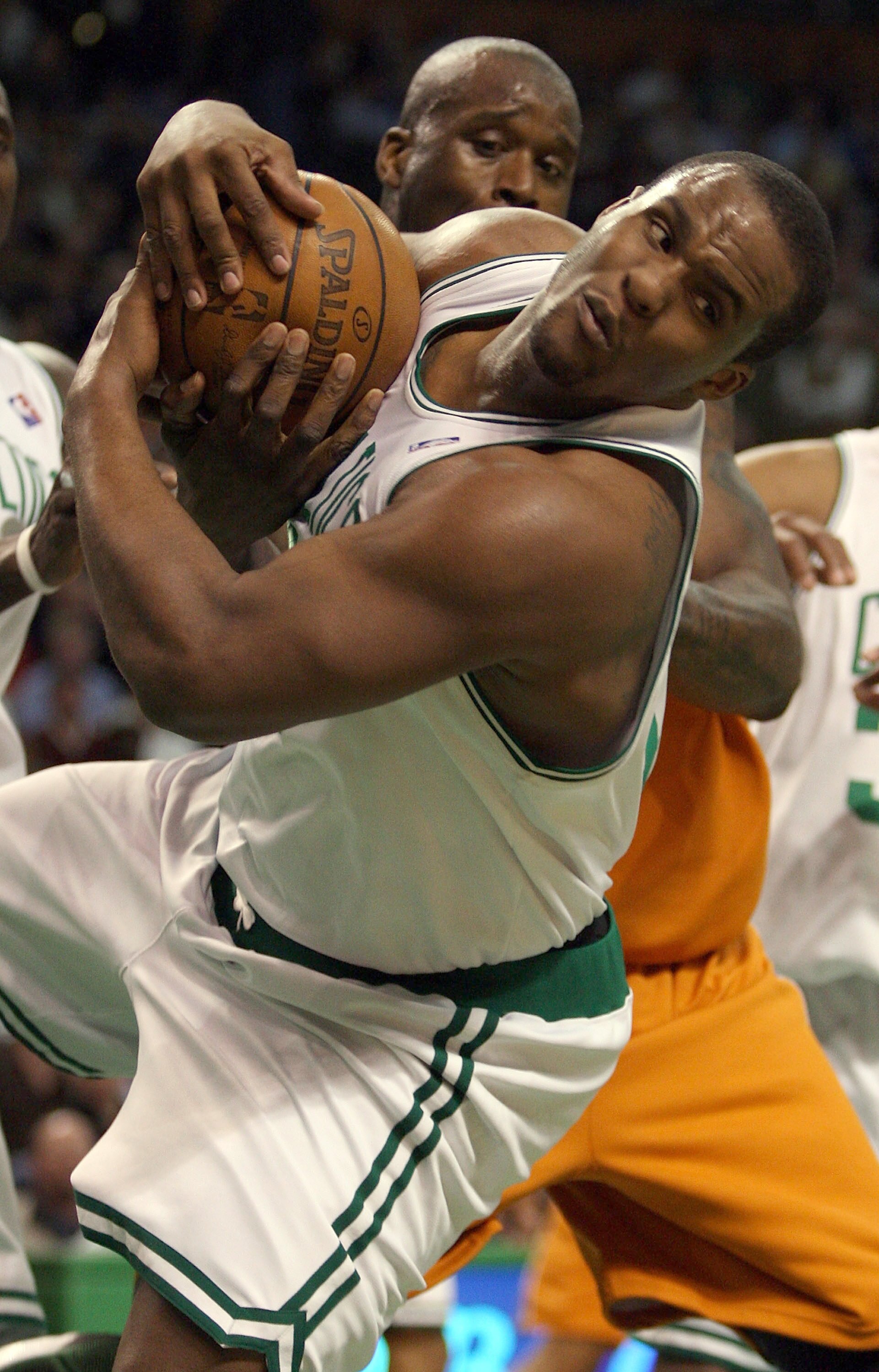 BOSTON - MARCH 26:  Glen Davis #11 of the Boston Celtics grabs the rebound from Shaquille O'Neal #32  of the Phoenix Suns on March 26, 2008 at the TD Banknorth Garden in Boston, Massachusetts. The Celtics defeated the Suns 117-97. NOTE TO USER: User expre