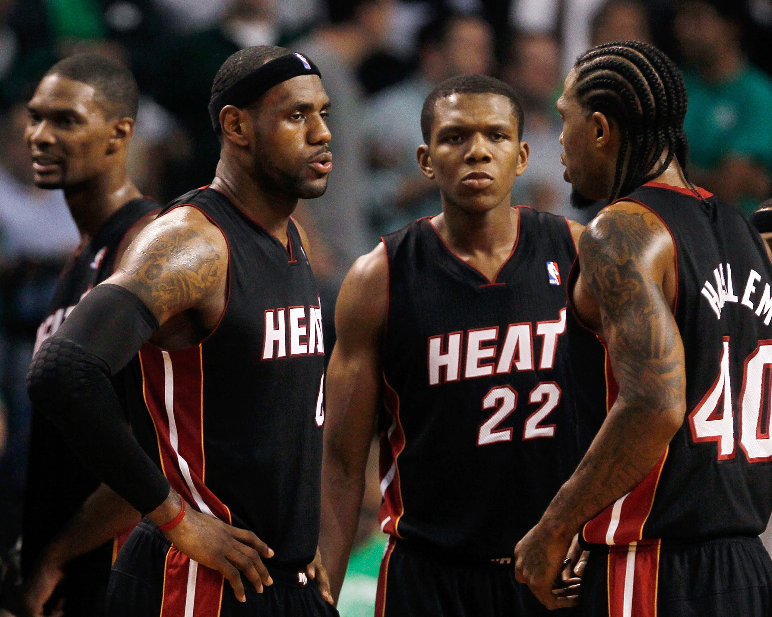 BOSTON, MA - OCTOBER 26: LeBron James #6 of the Miami Heat confers with teammates Chris Bosh #1, James Jones #22 and Udonis Haslem #40 during a game against the Boston Celtics at the TD Banknorth Garden on October 26, 2010 in Boston, Massachusetts .NOTE T