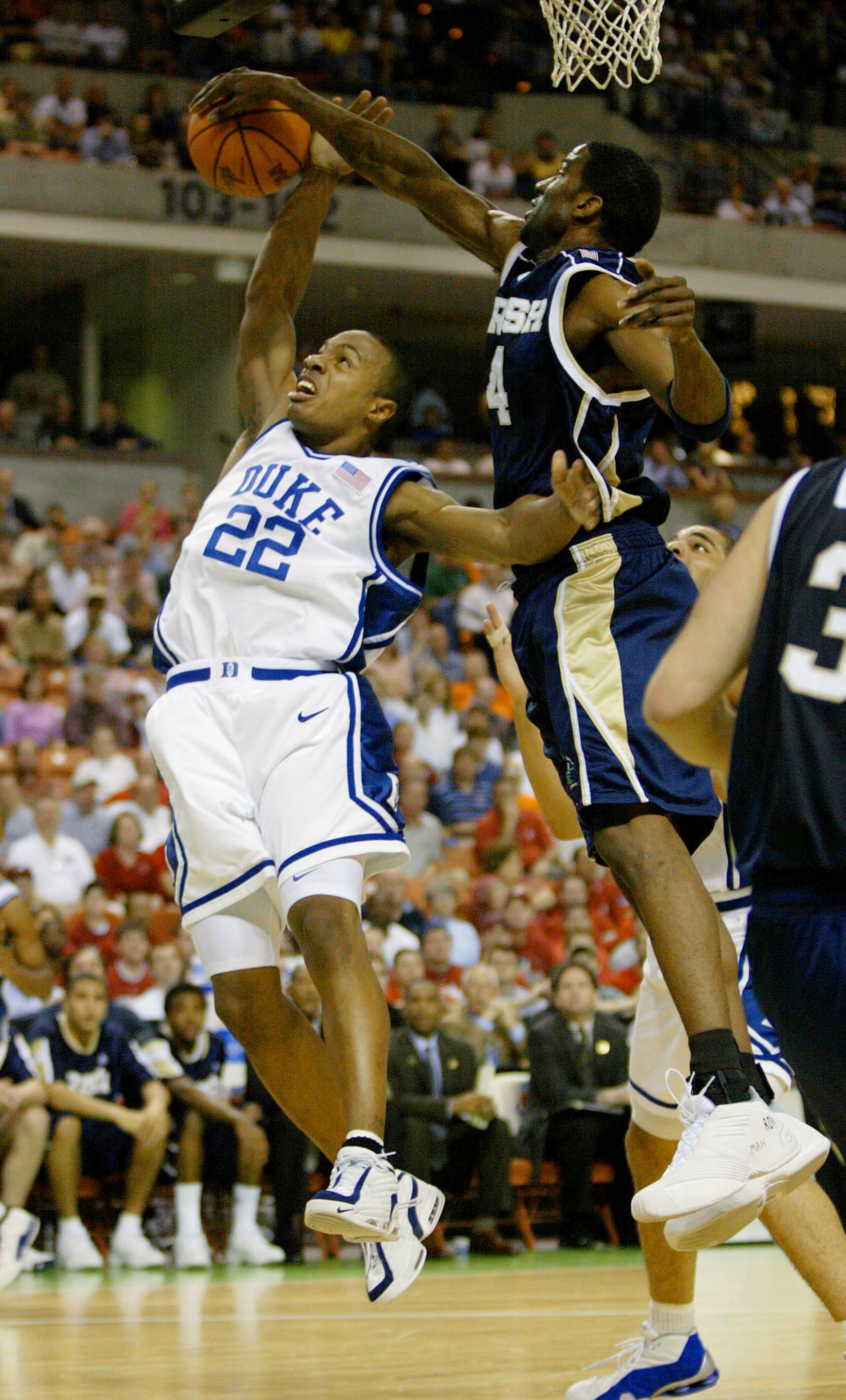 16 Mar 2002:  Jason Williams #22 of Duke has his shot blocked by Ryan Humphrey #4 of Notre Dame during their NCAA 2nd round basketball game at the Bi-Lo Center in Greenville, South Carolina. DIGITAL IMAGE.Mandatory Credit: Craig Jones/Getty Images