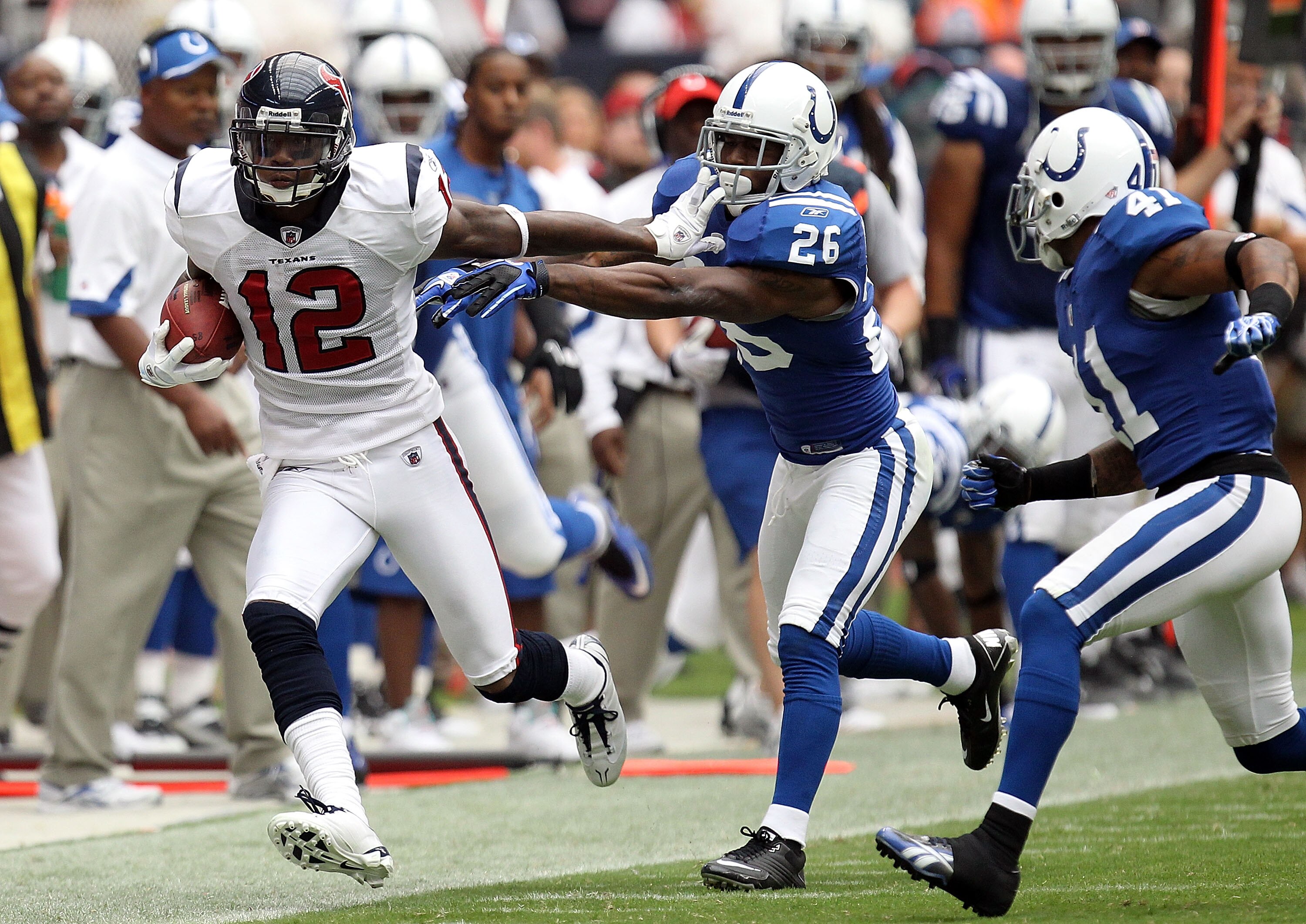 HOUSTON - SEPTEMBER 12:  Wide receiver Jacoby Jones #12 of the Houston Texans runs the ball past Kelvin Hayden #26 of the Indianapolis Colts at Reliant Stadium on September 12, 2010 in Houston, Texas.  (Photo by Ronald Martinez/Getty Images)