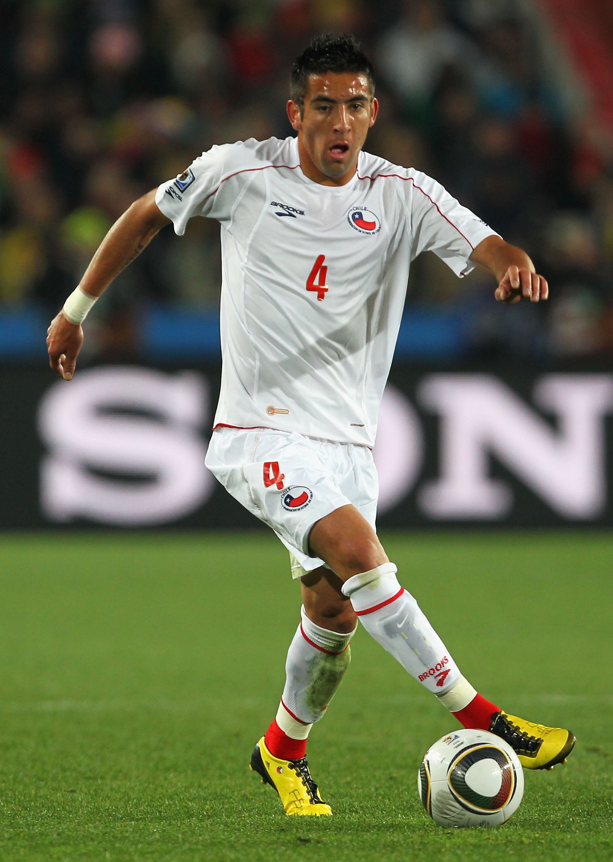 JOHANNESBURG, SOUTH AFRICA - JUNE 28: Mauricio Isla of Chile in action during the 2010 FIFA World Cup South Africa Round of Sixteen match between Brazil and Chile at Ellis Park Stadium on June 28, 2010 in Johannesburg, South Africa.  (Photo by Clive Rose/