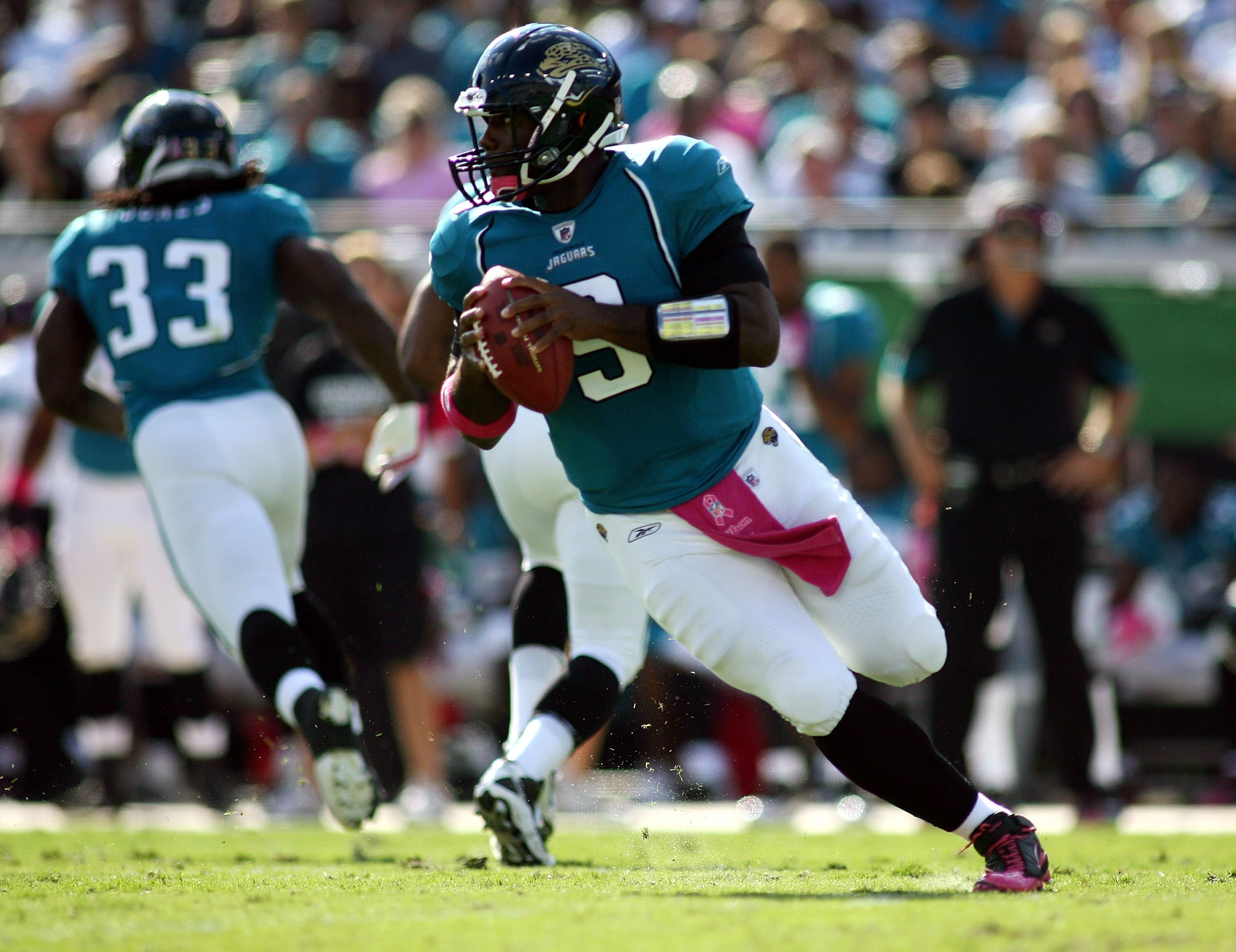 JACKSONVILLE, FL - OCTOBER 03:  Quarterback David Garrard #9 of the Jacksonville Jaguars rolls out against the Indianapolis Colts at EverBank Field on October 3, 2010 in Jacksonville, Florida.  (Photo by Marc Serota/Getty Images)
